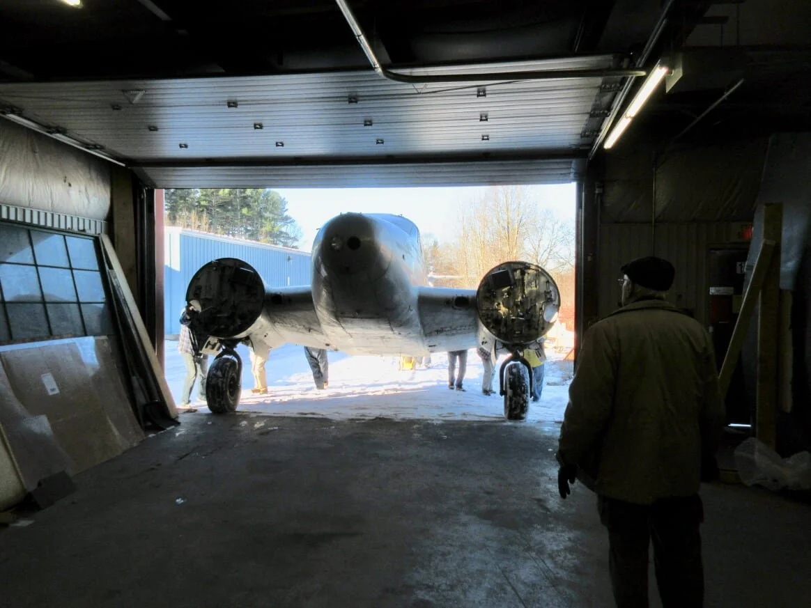  After being stored in 9 Hangar, the Expeditor fuselage was successfully shoehorned into the workshop, out of the weather, for the Christmas season. The “can-do” volunteers moved the Bolingbroke wings to the sides of the workshop until a major reshuf