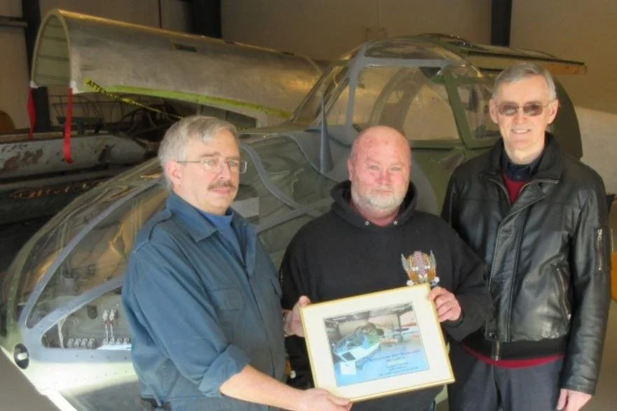 Presentation to Billy Deveau (Centre)