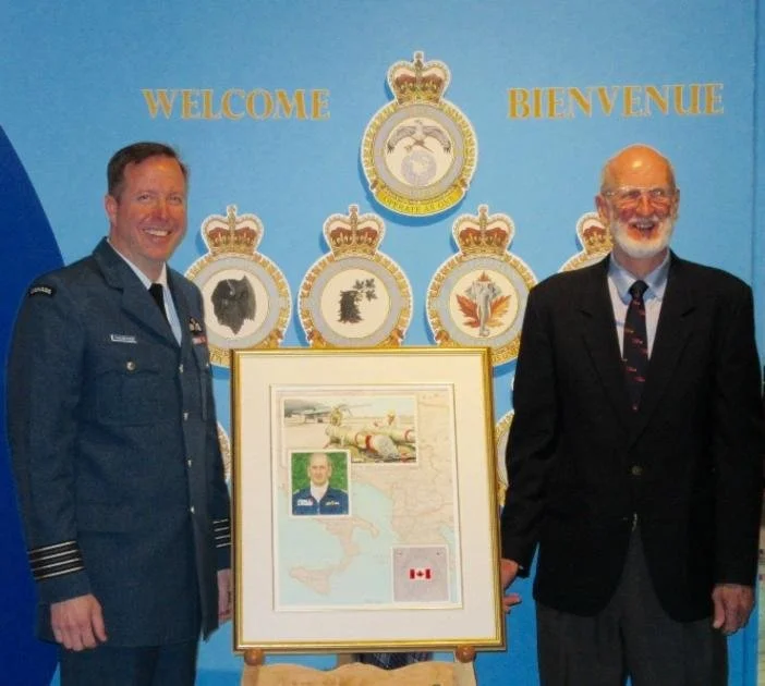 Col Pat Thauberger accepts the latest Greenwood Art Association commissioned painting by local artist Eileen Boyd depicting Operation Sharp Guard