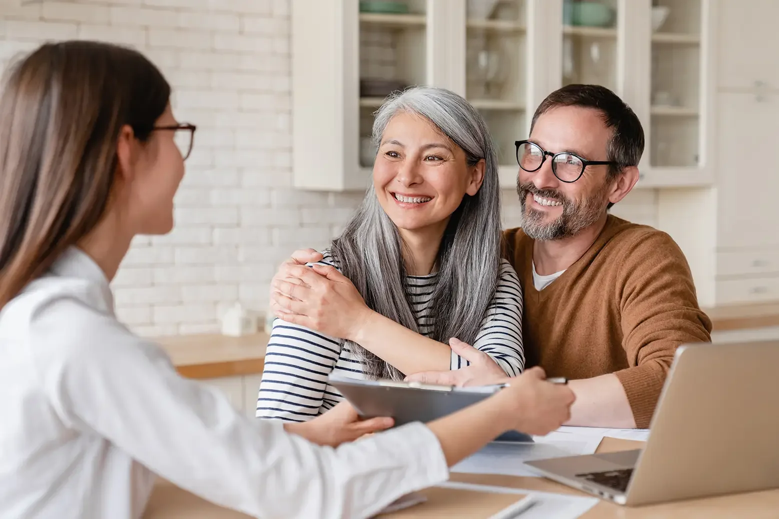 successful-positive-deal-lawyer-financial-advisor-helping-consulting-showing-contract-mortgage-loan-credit-business-startup-signing-documents-by-matute-middleaged-couple-home copy.webp