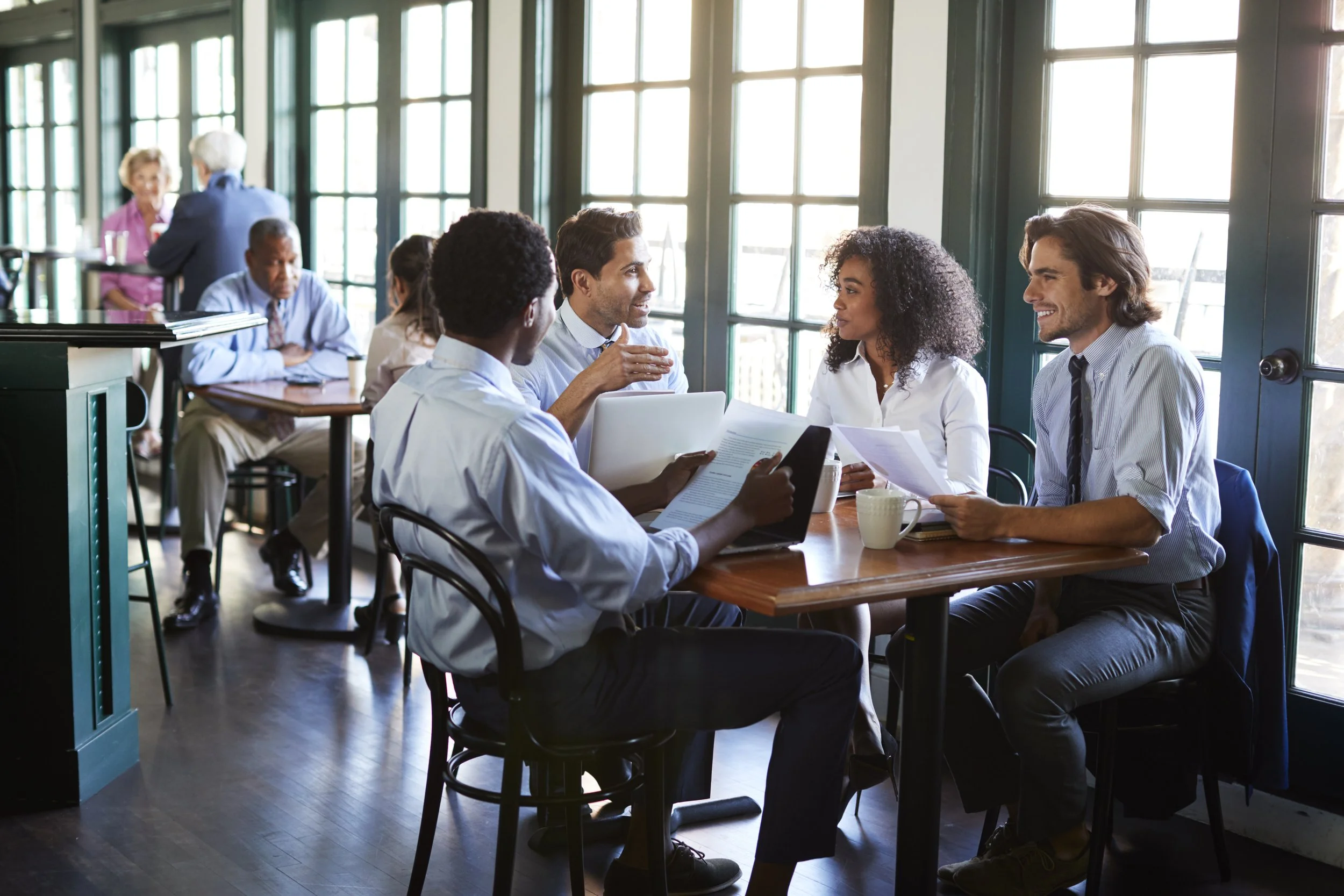 business-team-having-informal-meeting-around-table-2026-03-10-03-15-28-utc.jpg