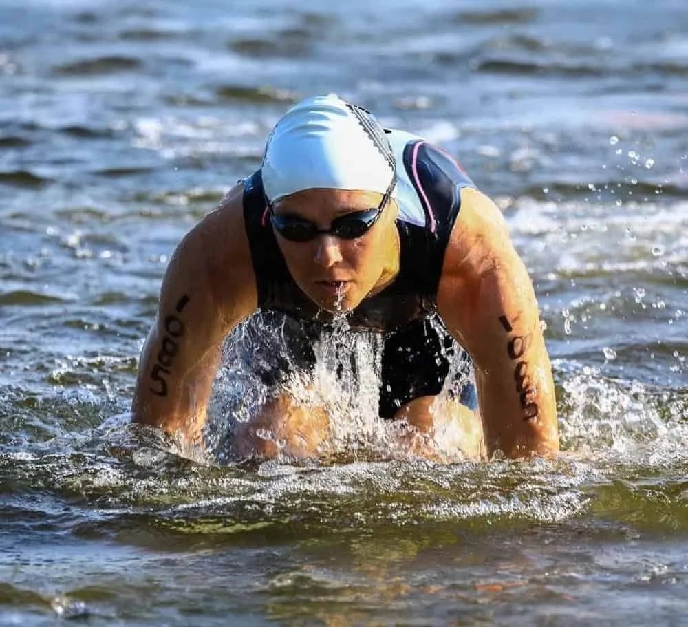 Dr. Hannah DePaul physical therapist exiting the water during a triathlon competition