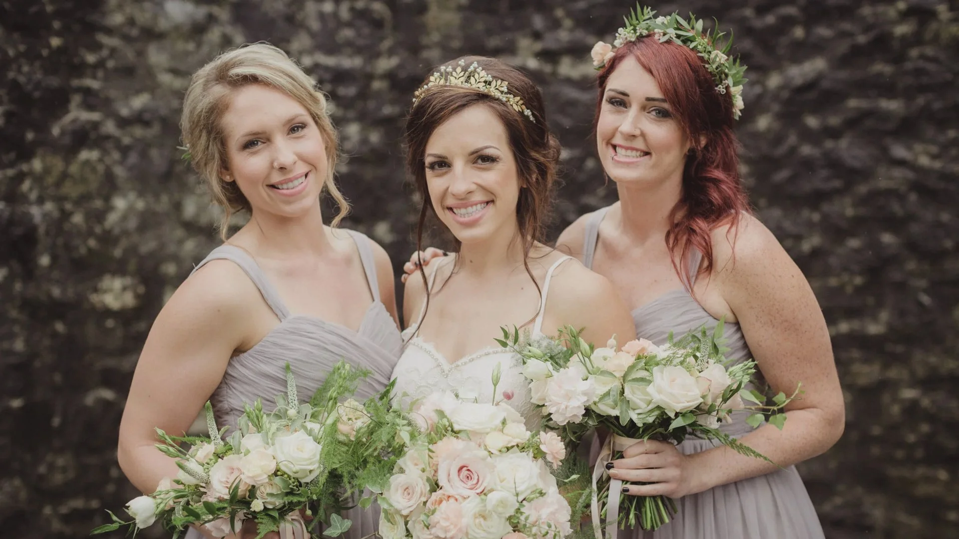 bride and bridesmaids with flowers