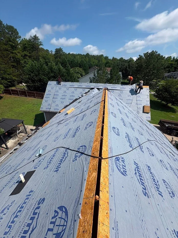 Underlayment is installed to shield the roof before shingles are installed.