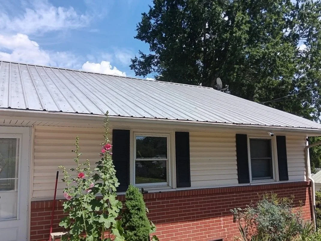A classic silver metal roof protects a residential home in North Carolina.