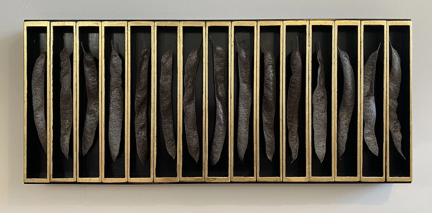 Universe in Every Seed
36.75” x 15.5” x 3.125”
Artist collected Honey Locust seed pods, metallic glitter paint, gold leaf, Vintage sewing machine drawers, paint
2023