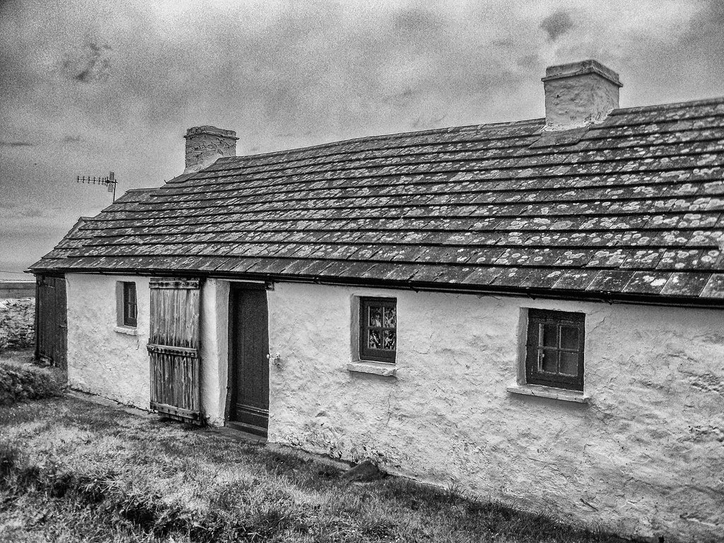 Traditional Welsh cottage undergoing careful conservation using heritage materials and methods.