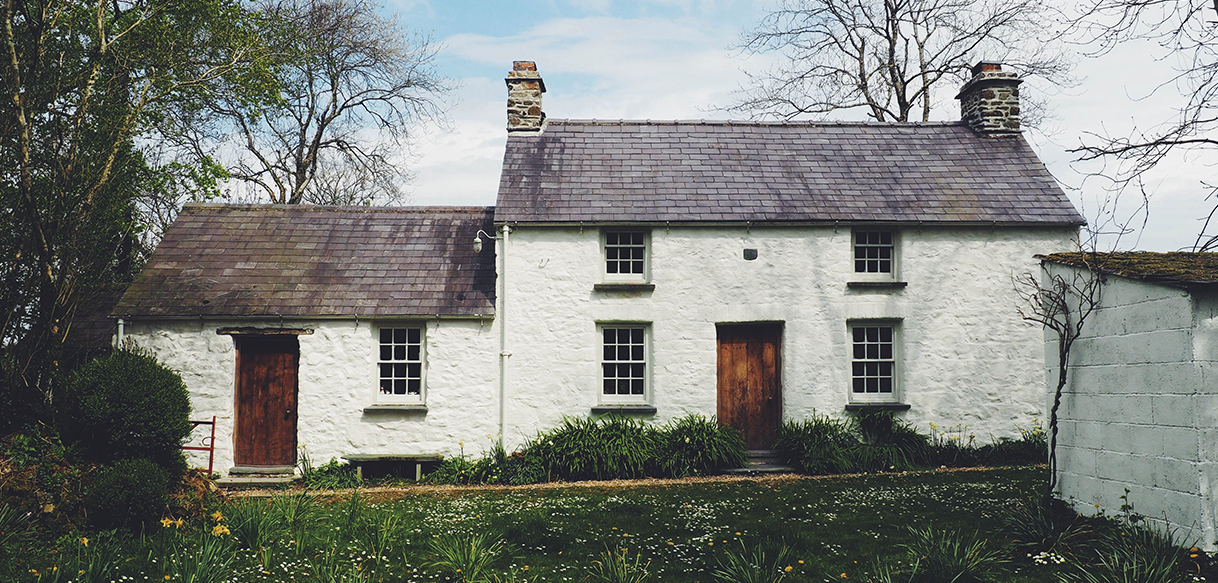 Image of a traditional Welsh cottage restored with heritage materials for the Bwythyn conservation project.