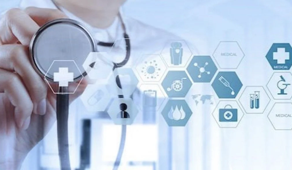 A healthcare professional in a white coat holding a stethoscope with digital medical icons and hexagons displayed in a futuristic style.