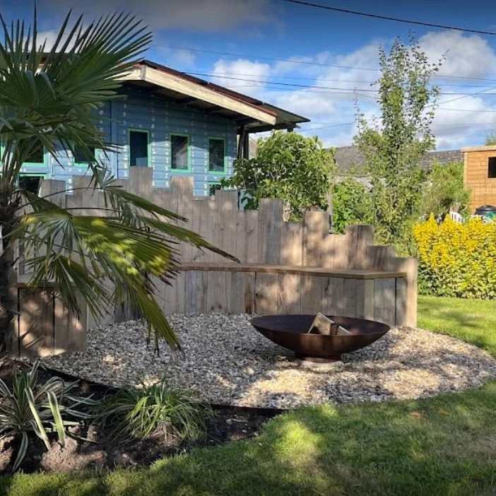 Firepit seating area in East Sussex constructed from sleepers by AG Home & Gardens