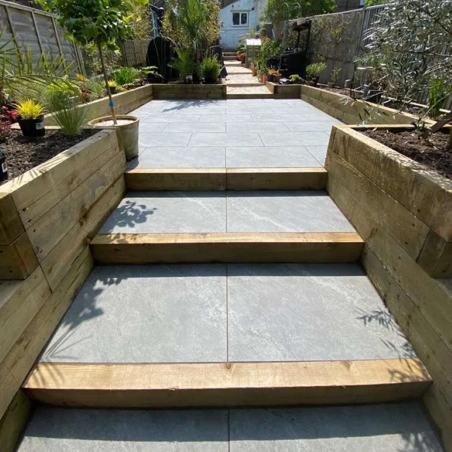 An installation of raised sleeper beds and patio for a courtyard garden in Kent by AG Home & Gardens