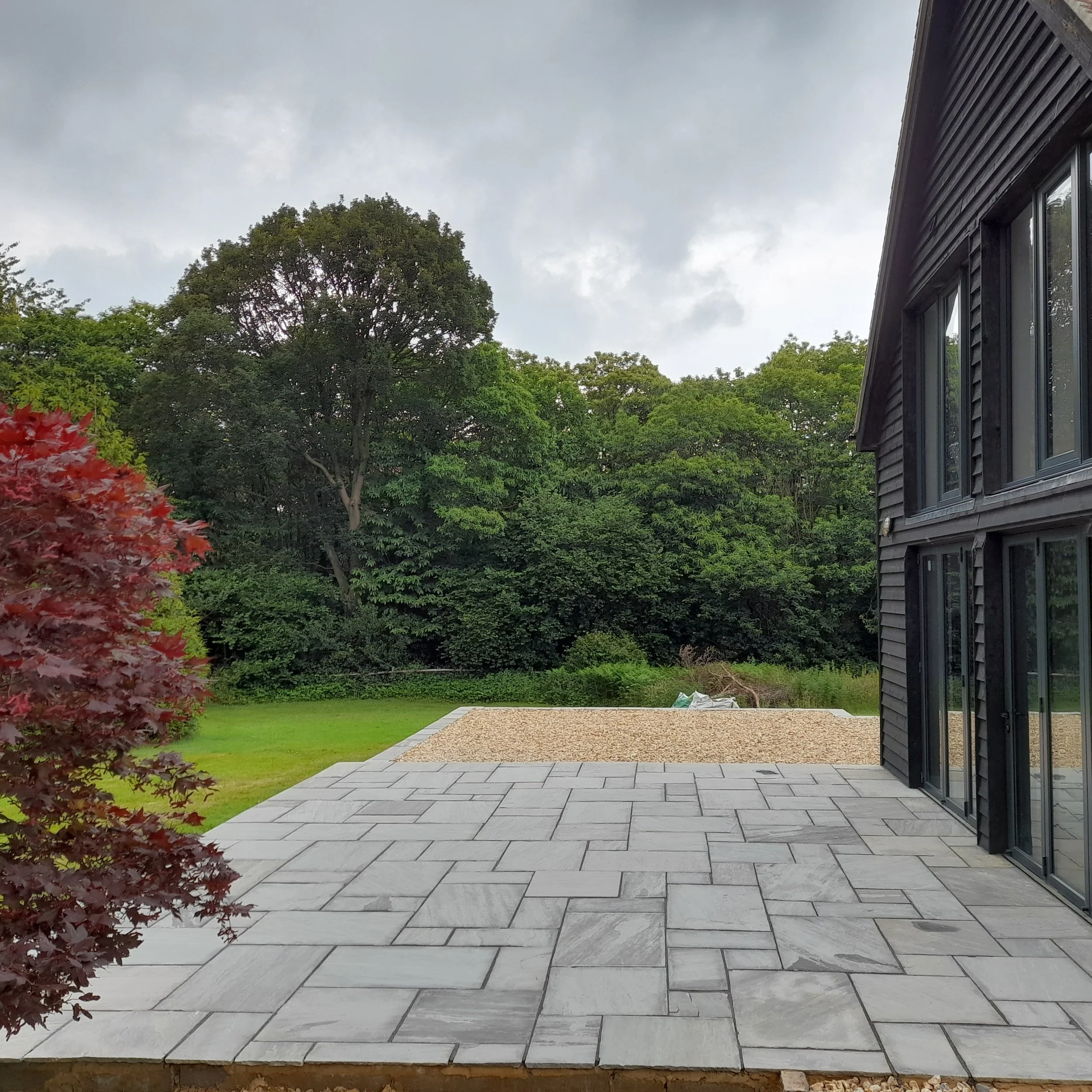 Sandstone patio & paving installation for a garden in East Sussex by AG Home & Gardens