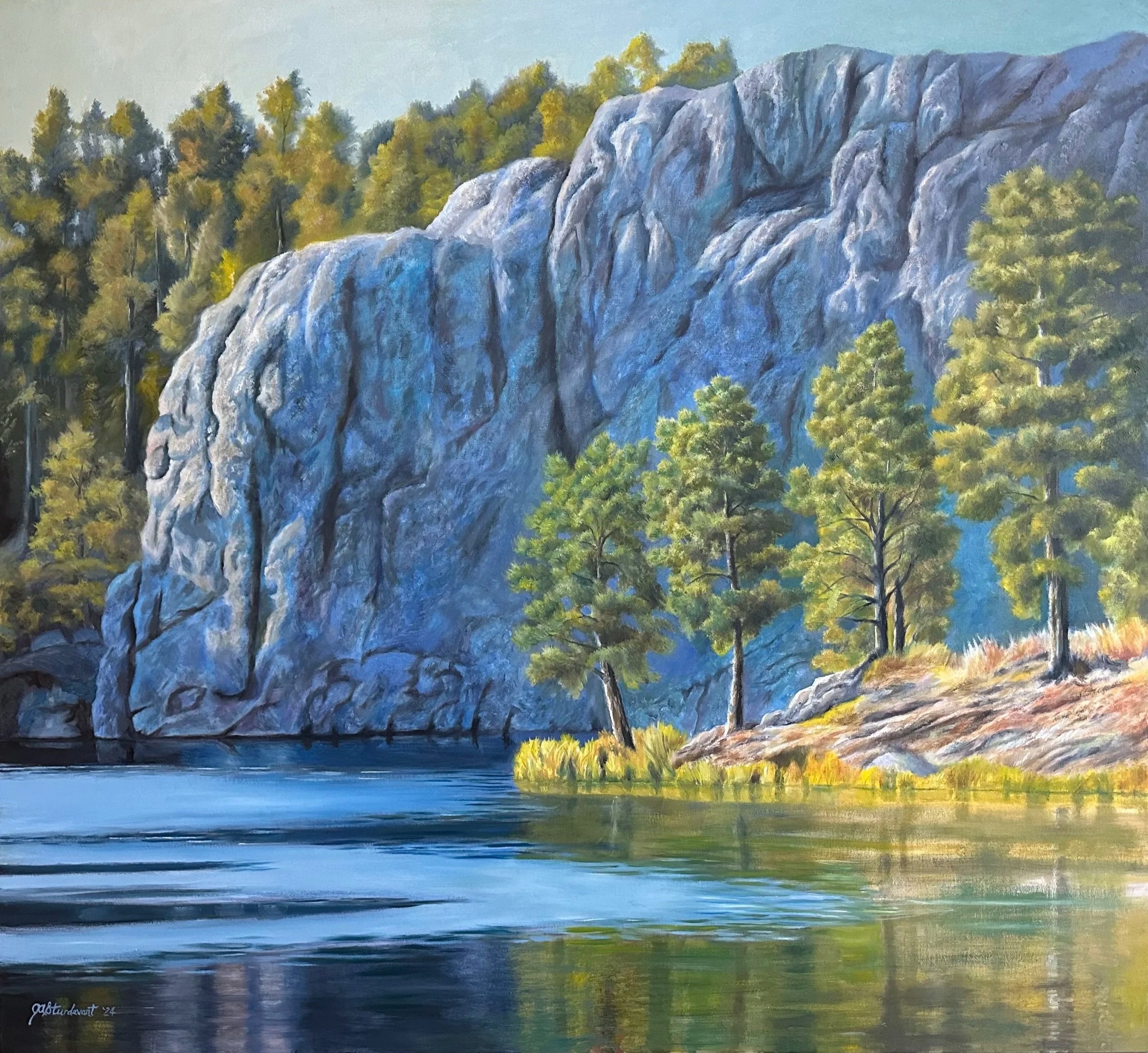Painting of a serene river landscape with large rocks and tall pine trees on the bank, with a forested hillside in the background.