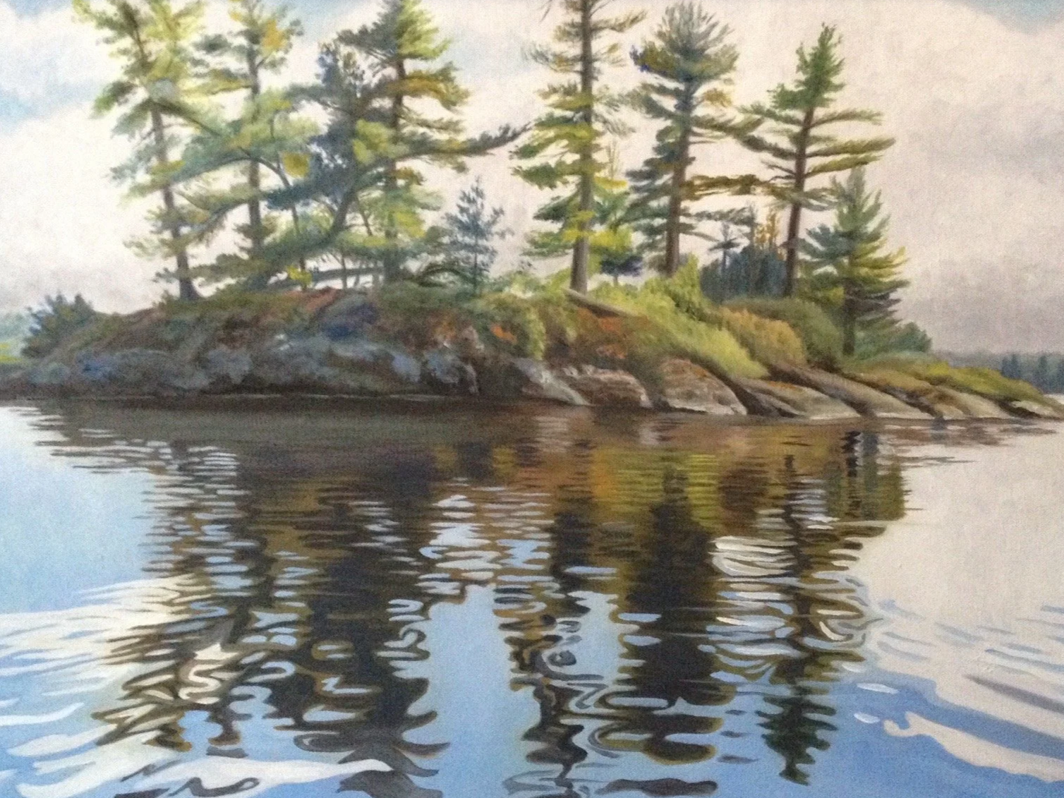 Painting of a small island with pine trees next to a body of water, reflecting the island and trees.
