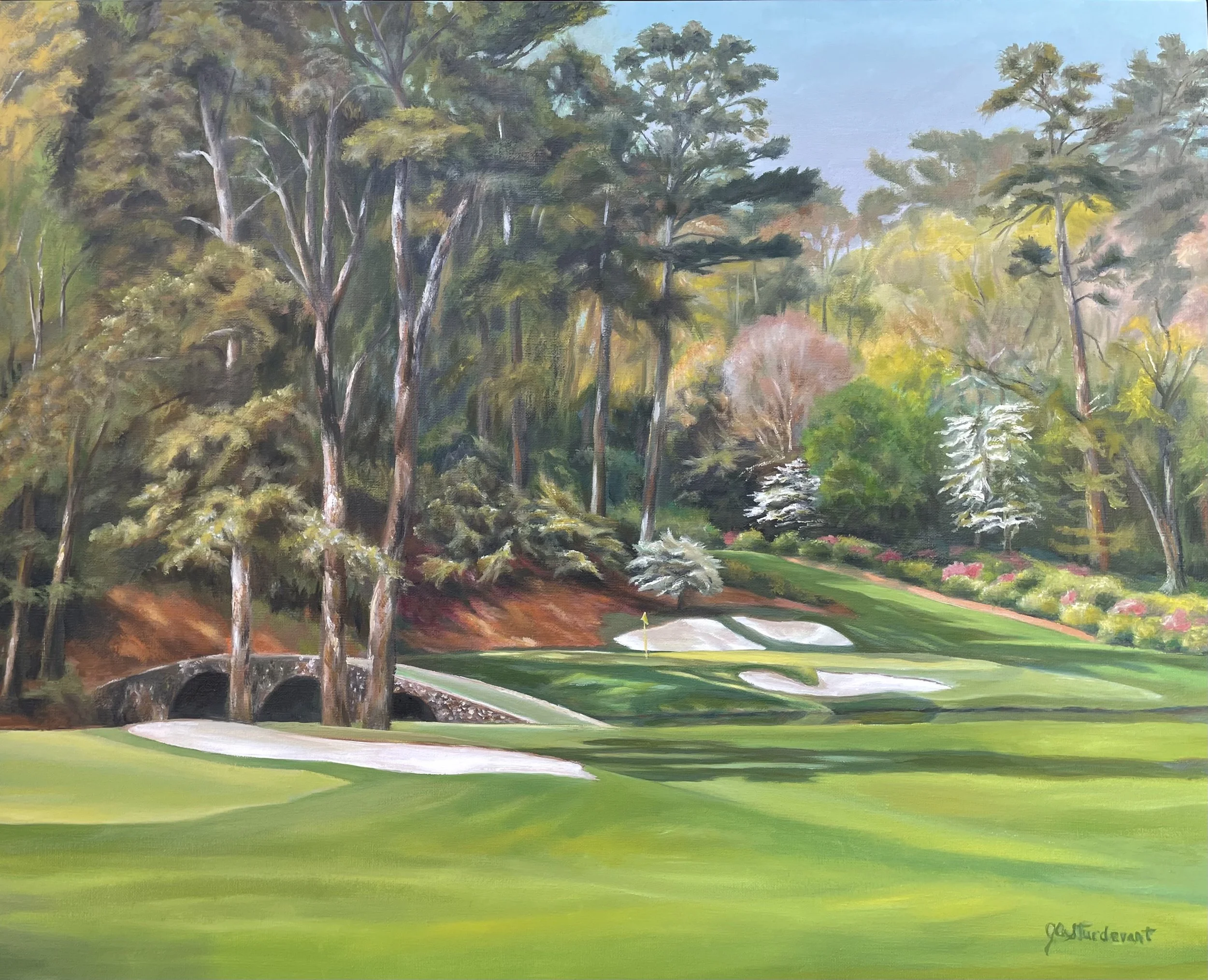 A painting of a golf course with sand traps, a green, and an arched stone bridge among tall trees and colorful shrubs.