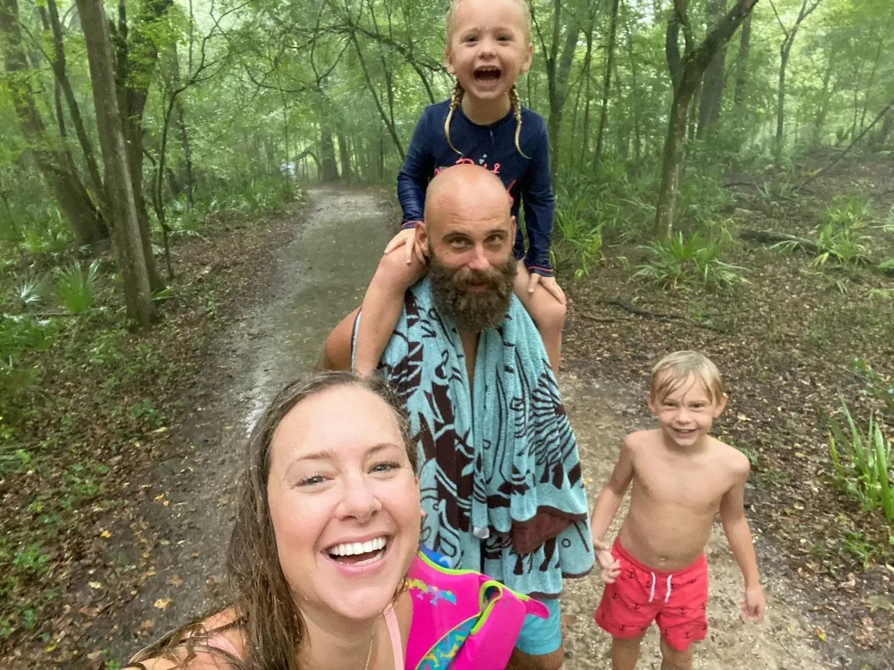 Drenched in rain coming back from Blue Hole... no rain is going to stop us from having a good time. Smiles all around!