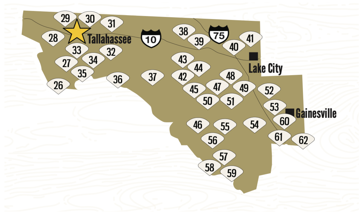 Map of Florida showing numbered counties, with three highlighted cities: Tallahassee with a star, Lake City, and Gainesville.
