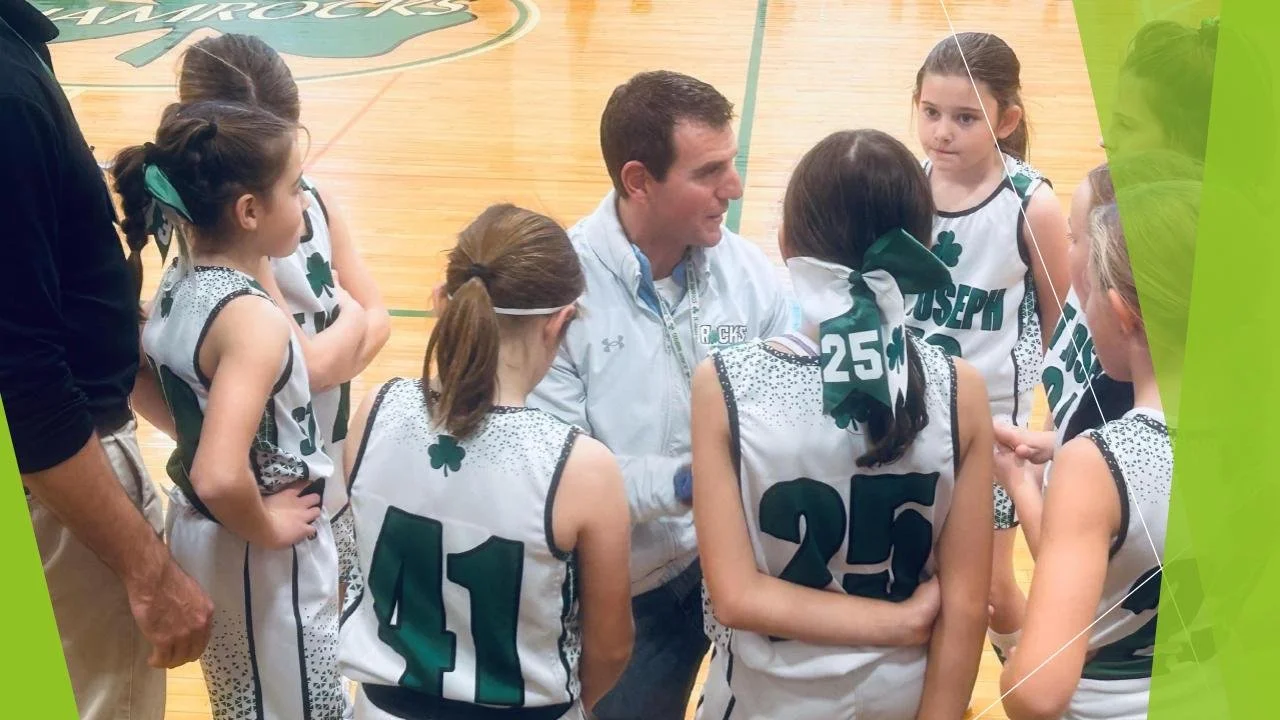 basketball team meeting with coach