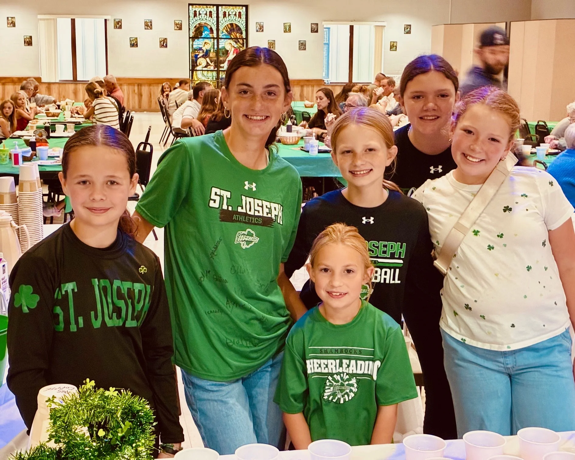SJS student volunteers serve drinks