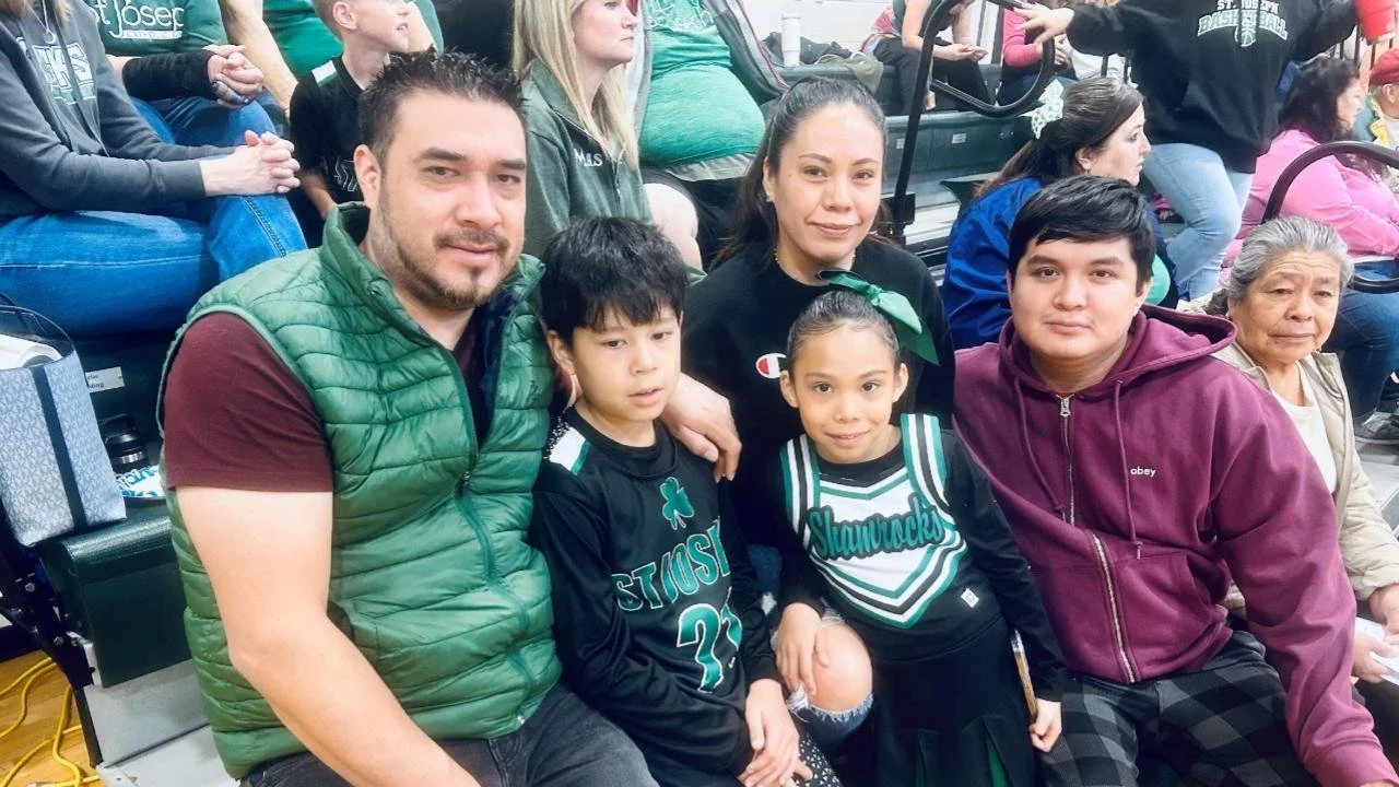 St. Joseph School family watching basketball game