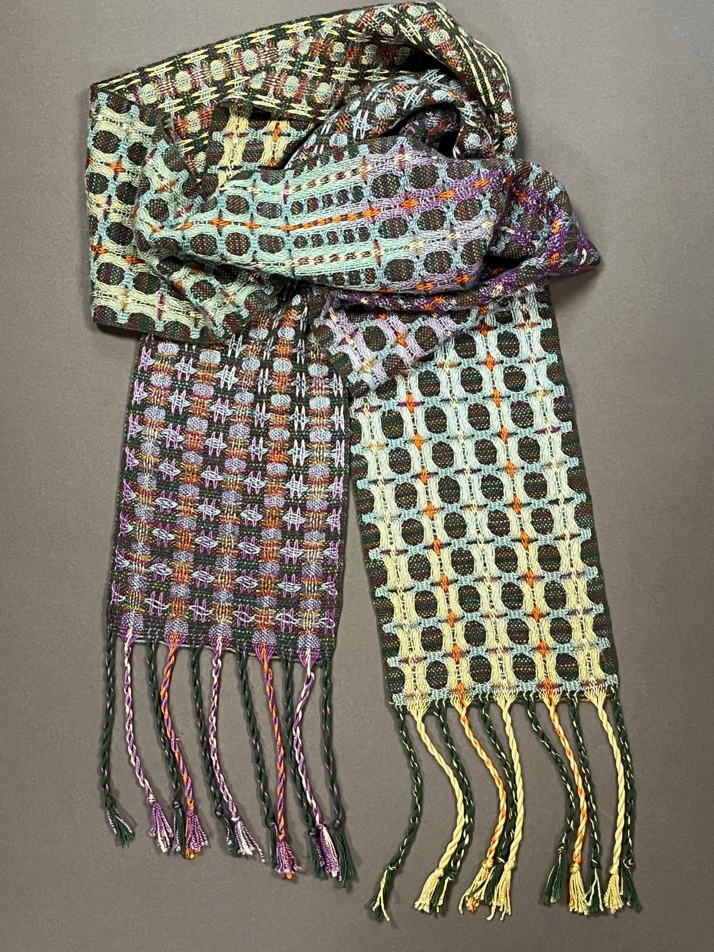 Deflected doubleweave utilizing a painted warp, which changes color along length of scarf, woven in Tencel