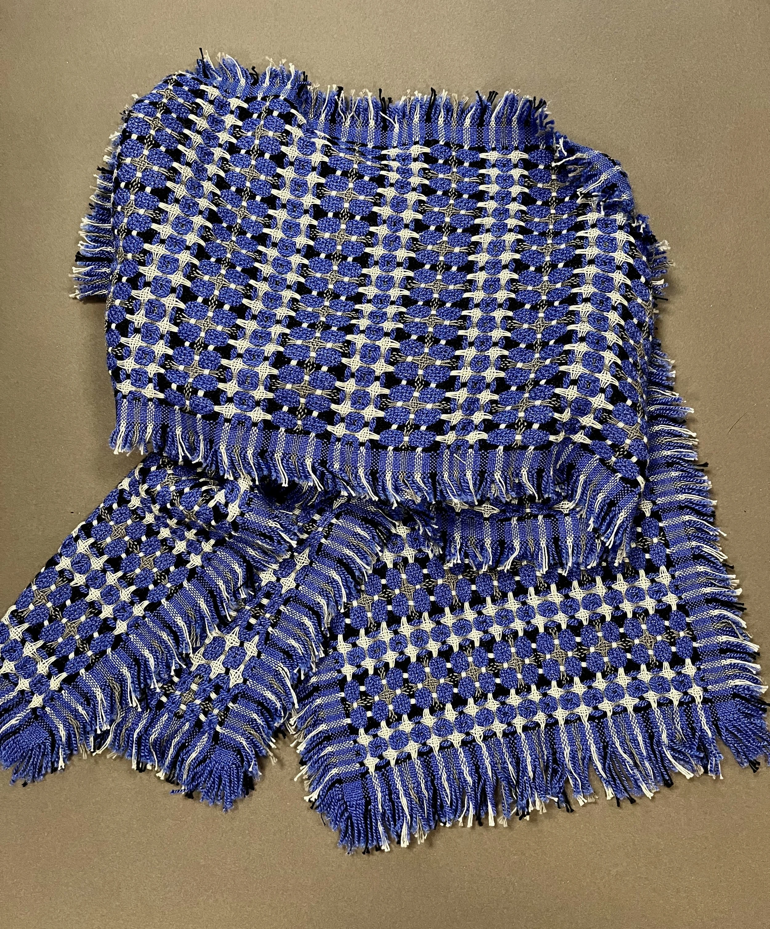 A combination of wool/silk and cotton in a deflected doubleweave with fringe on all four sides