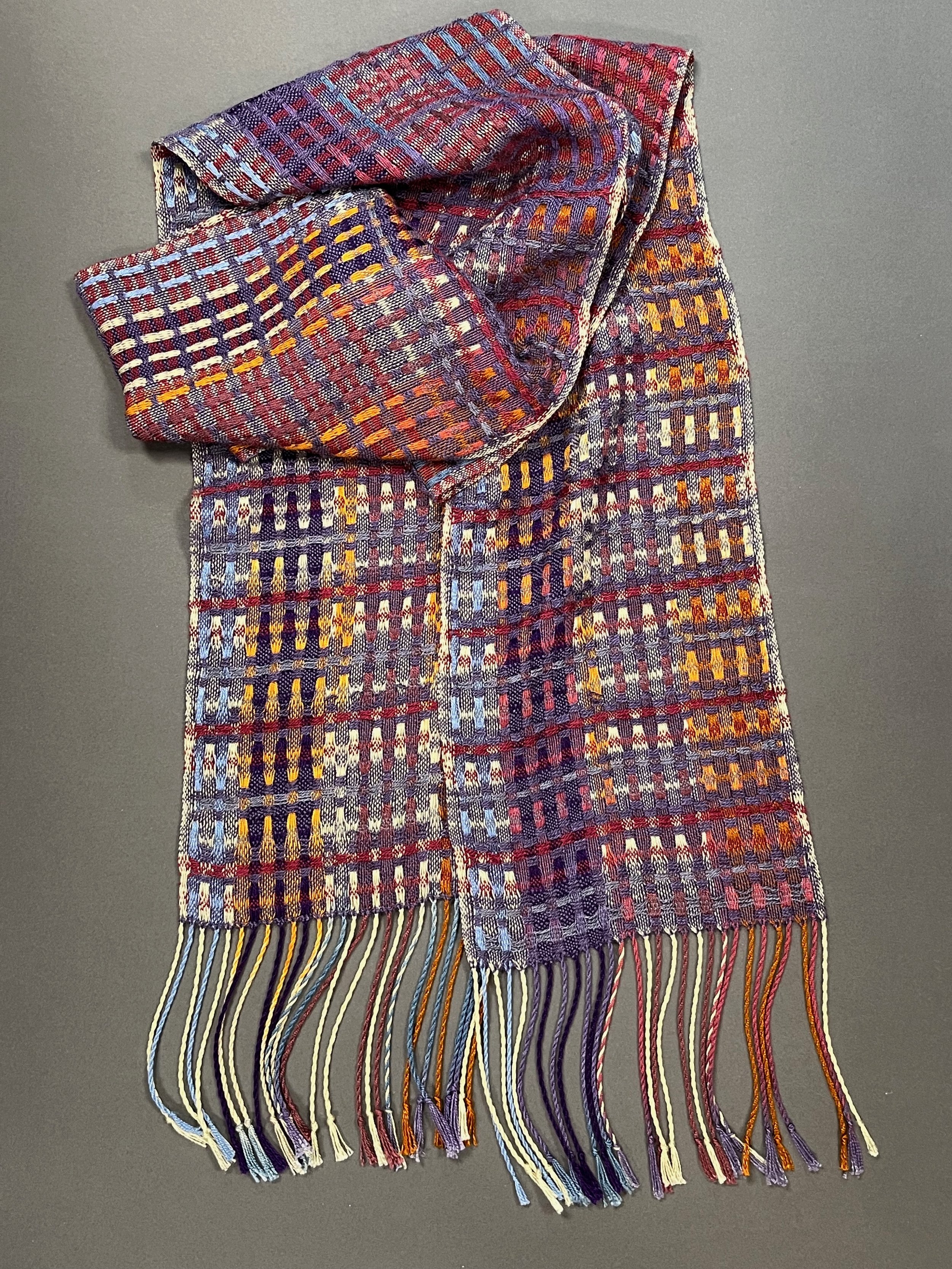 Multiple hand-painted warps change color along the length of this Tencel scarf