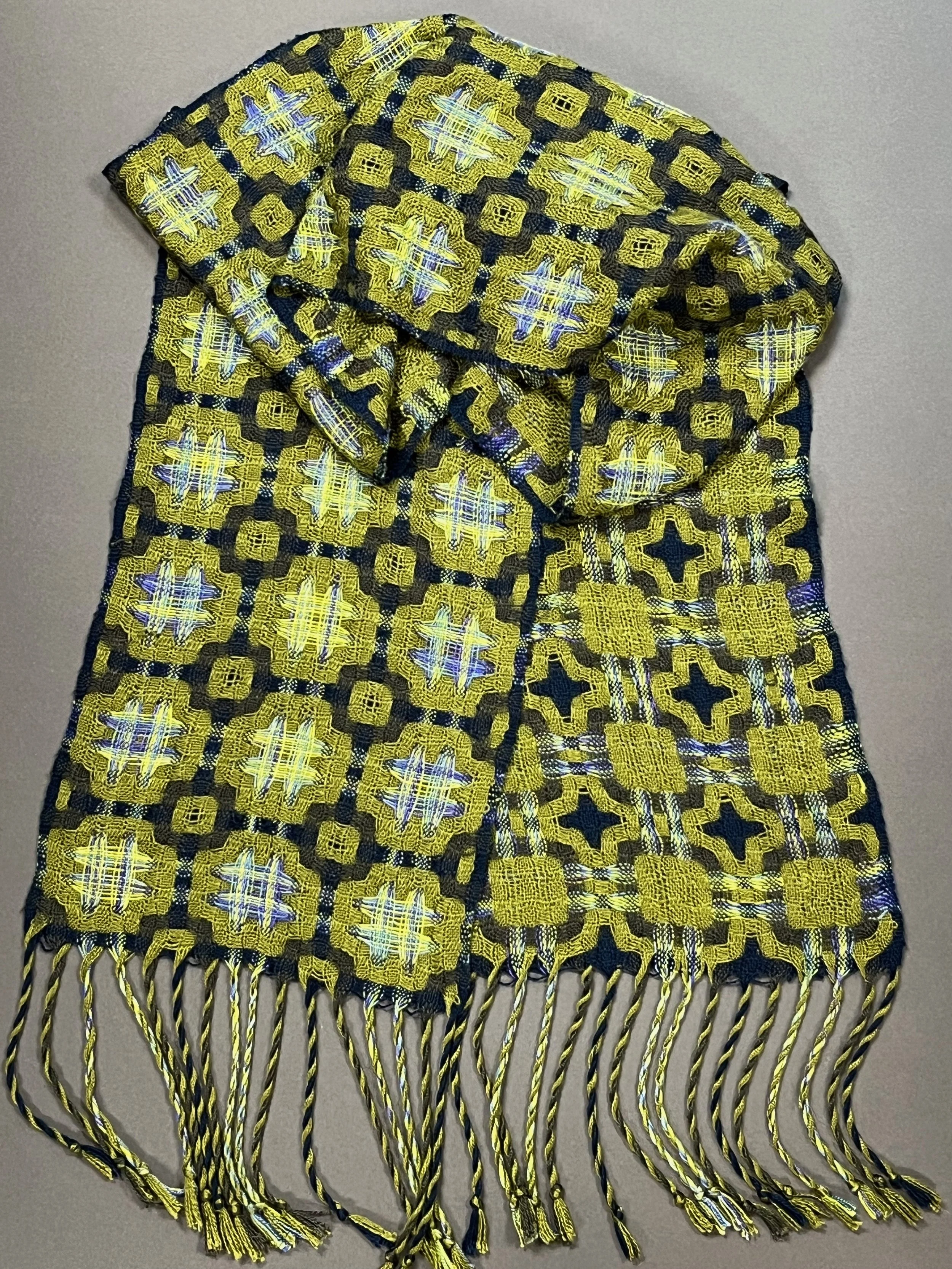 Hand-painted Tencel surrounded by olive green and navy borders in deflected doubleweave