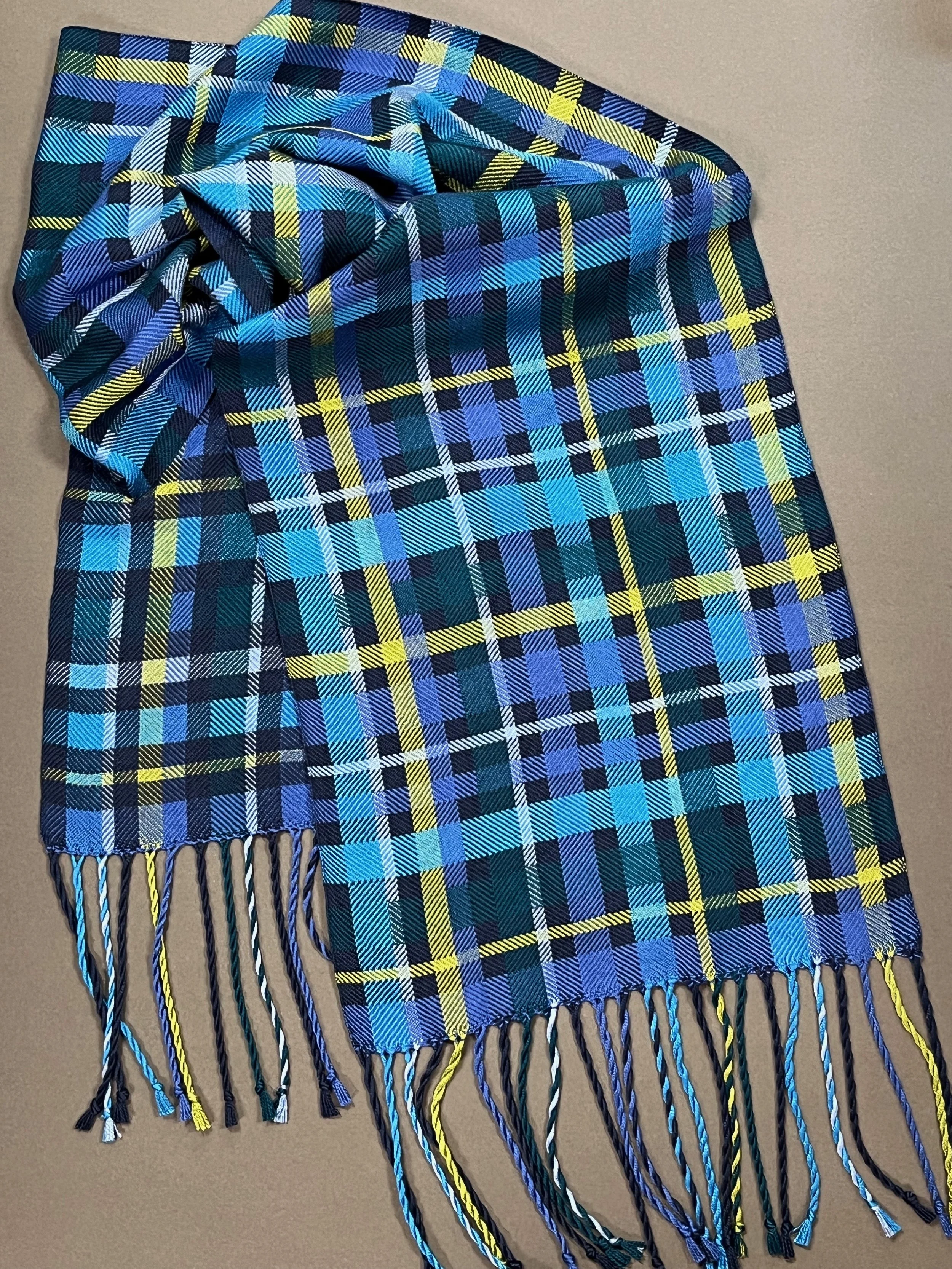 Turned twill ribbon overlays in five shades of blue silk with a splash of lime green