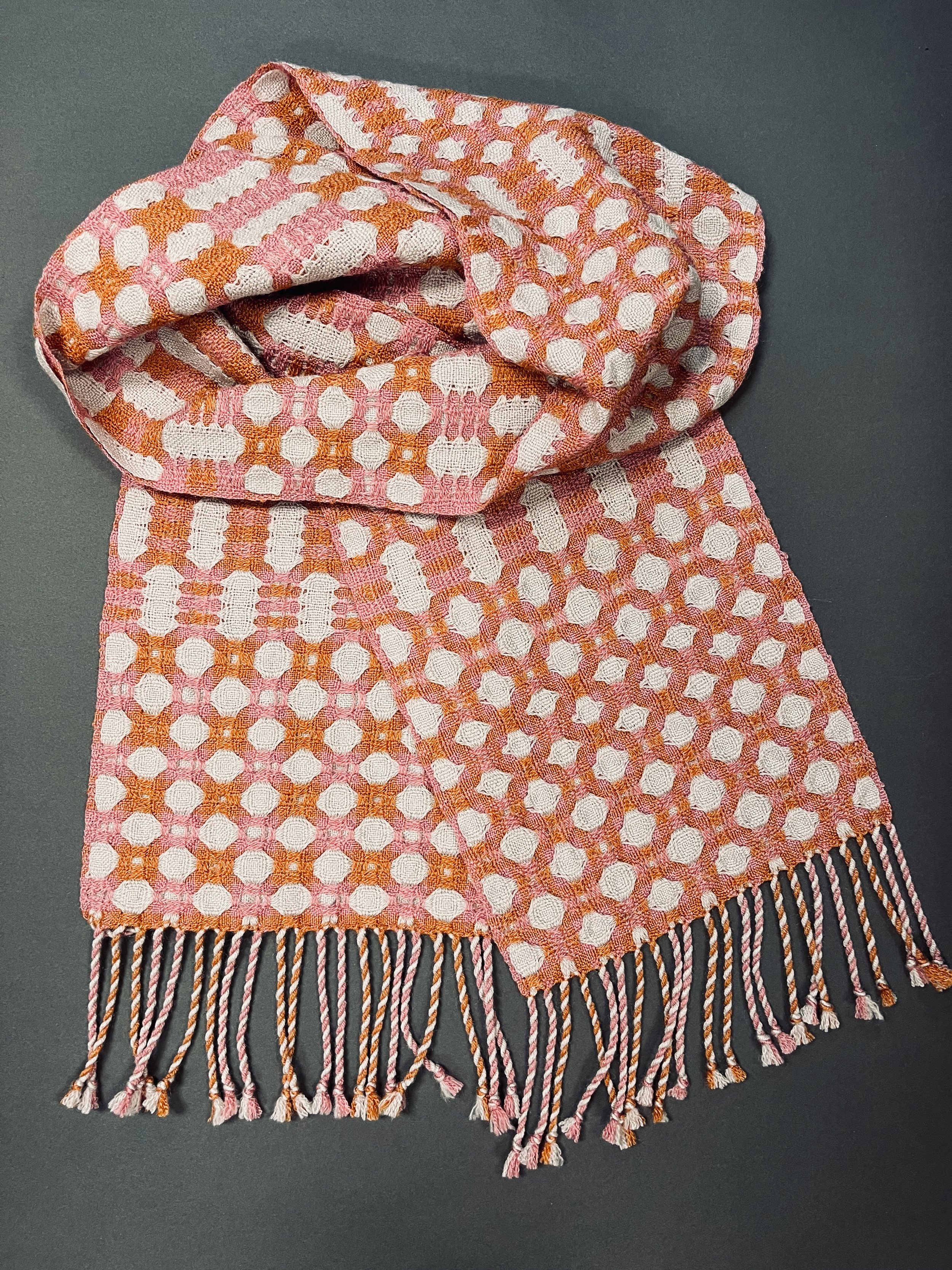Subtle interplay of silver, orange and pink in 50% silk/50% wool blend