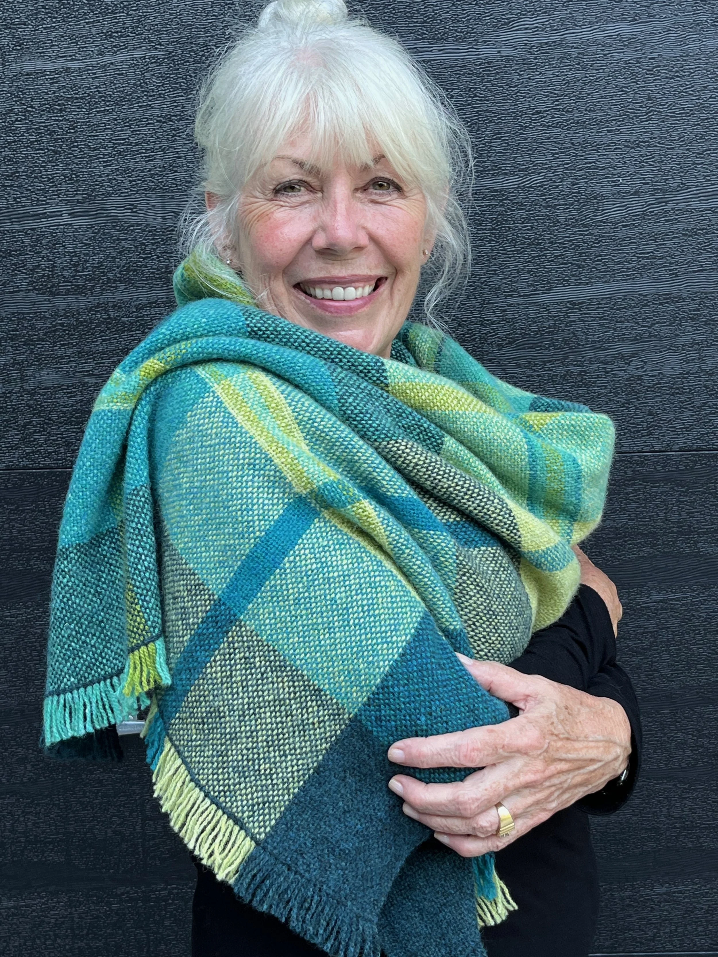 A generous shawl or even a lap robe, woven in Shetland wool with intentions of a Tartan plaid 
