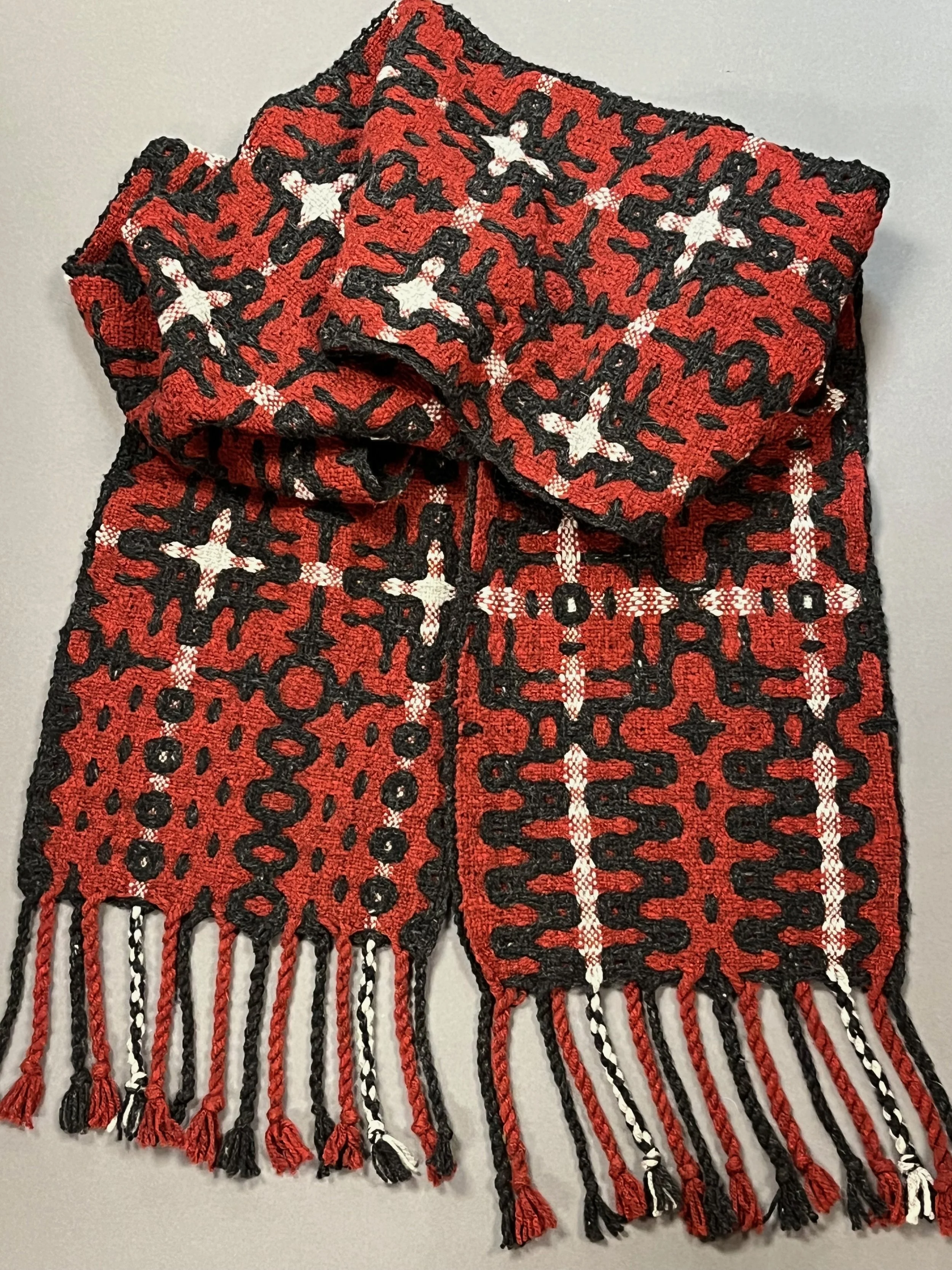 A chunky, asymmetrical 100% wool scarf