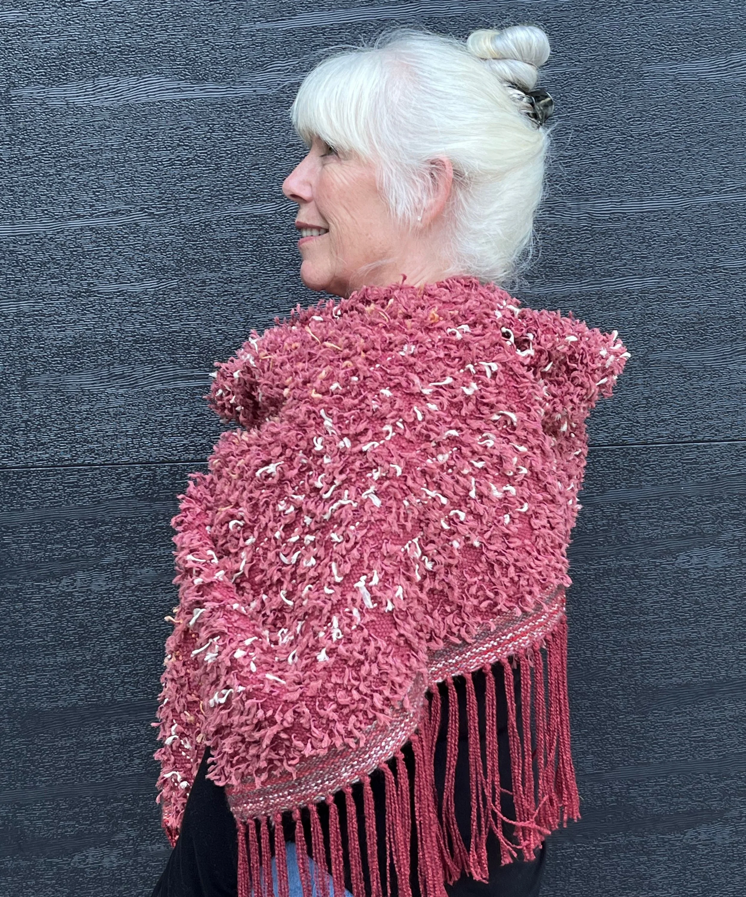 Ala Annie Albers, eyelash fiber is painstakingly inlaid in multiple colors to create this highly textured shawl