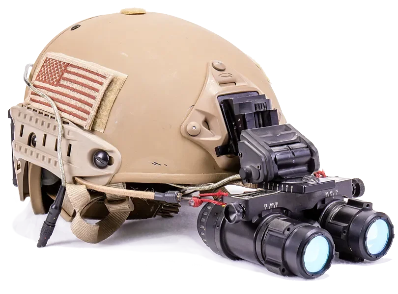 Military helmet with night vision goggles attached and an American flag patch.
