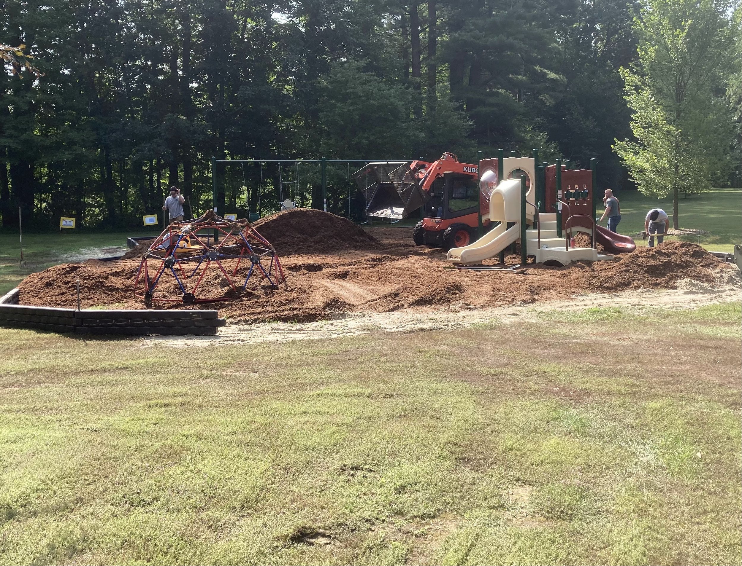 Adding dirt and wood chips.