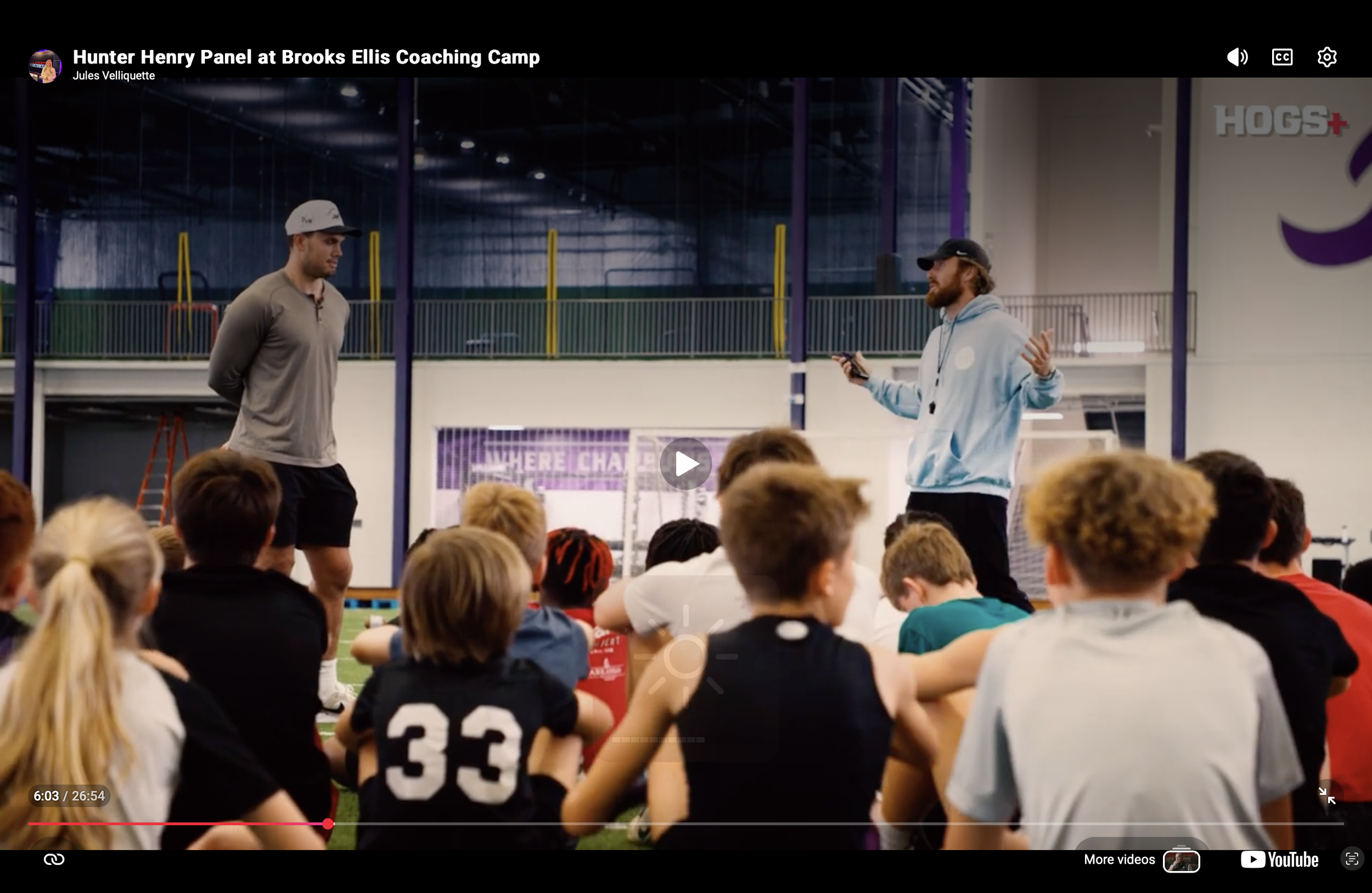david brooks ellis and hunter henry give a panel to young athletes at a football skills camp hosted by brooks ellis coaching at fayetteville high school. david wears a light blue BEC hoodie, asks Hunter Henry about leadership, overcoming adversity, a