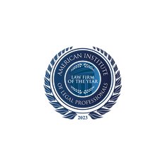 Seal with a blue wreath and text indicating American Institute Law Firm of the Year 2023 for legal professionals.