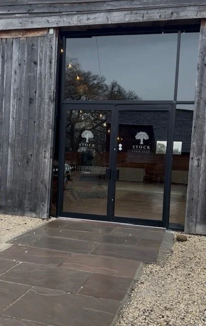 the glass doors entering stock farm barn