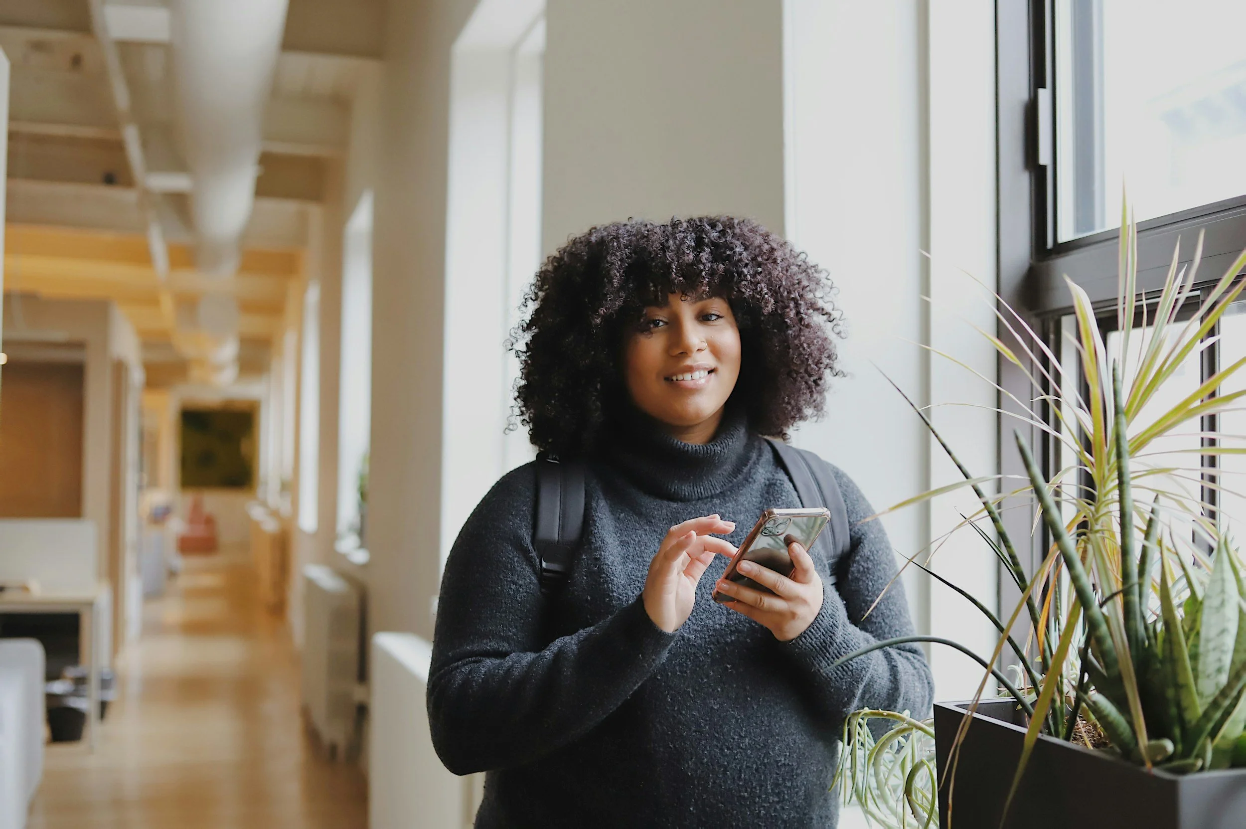 College student wearing a backpack, receiving support for academic stress and life transitions in Fargo, ND and Moorhead, MN.