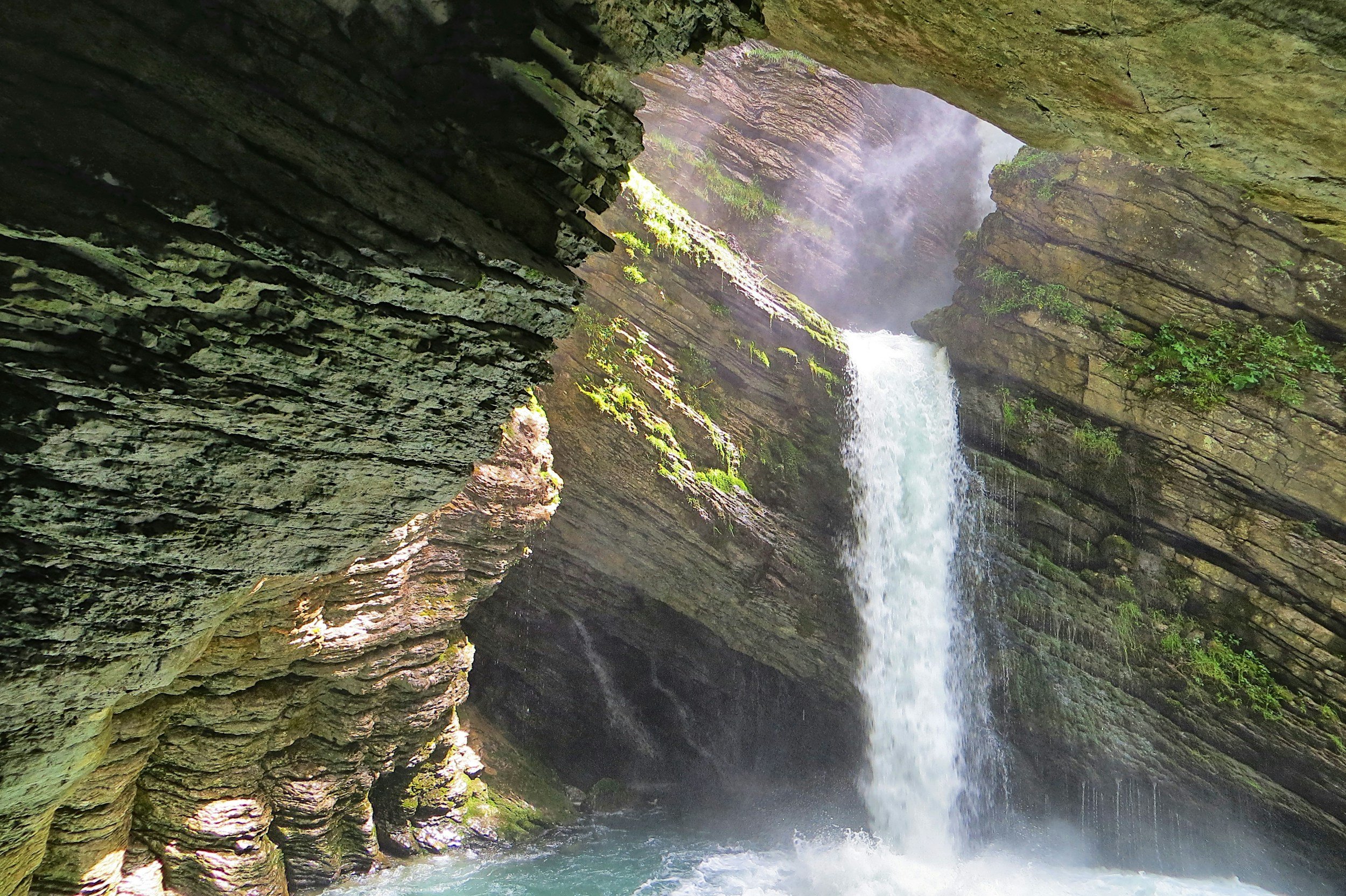 Waterfall flowing from cave representing renewal and moving forward from depression and feeling stuck