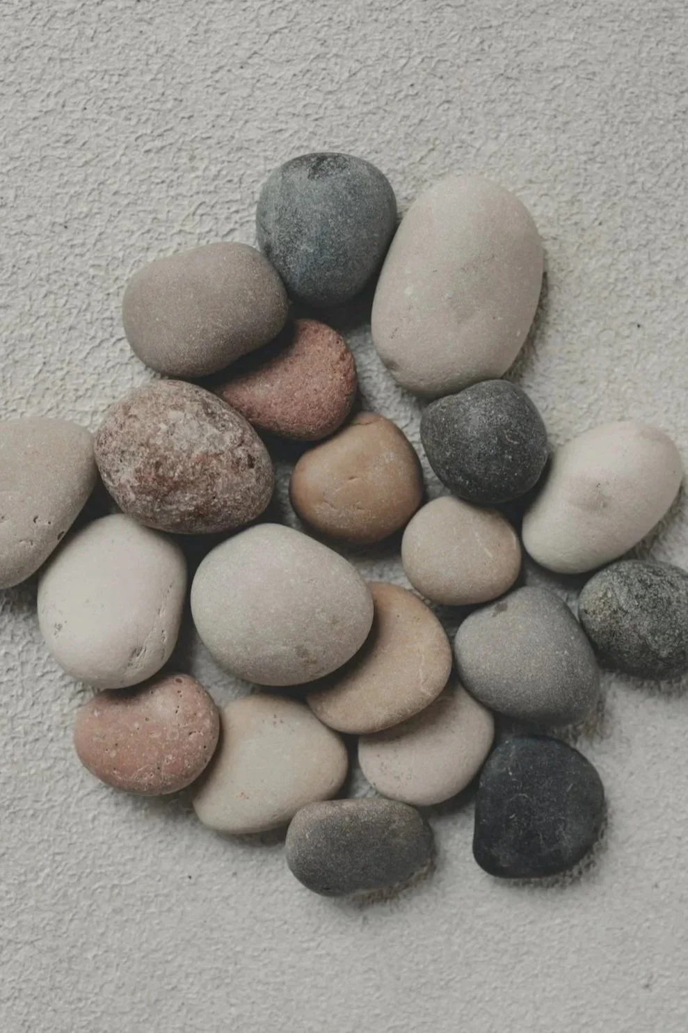 Smooth rocks arranged in balance representing healing and emotional processing through EMDR