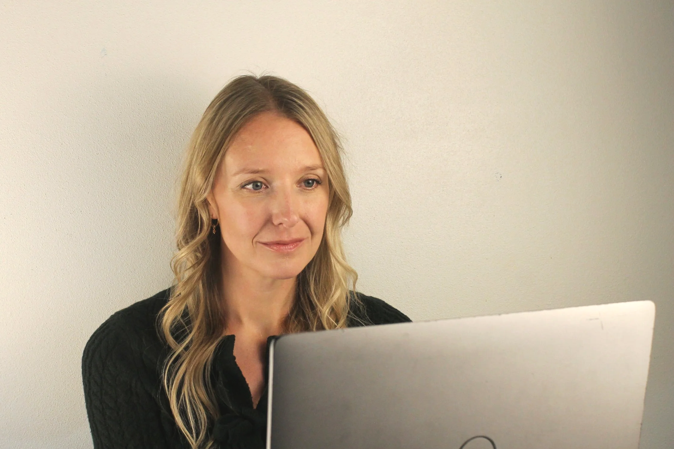 Dr. Erica Stene Winkler providing a secure online therapy session via telehealth for adults in Minnesota and North Dakota