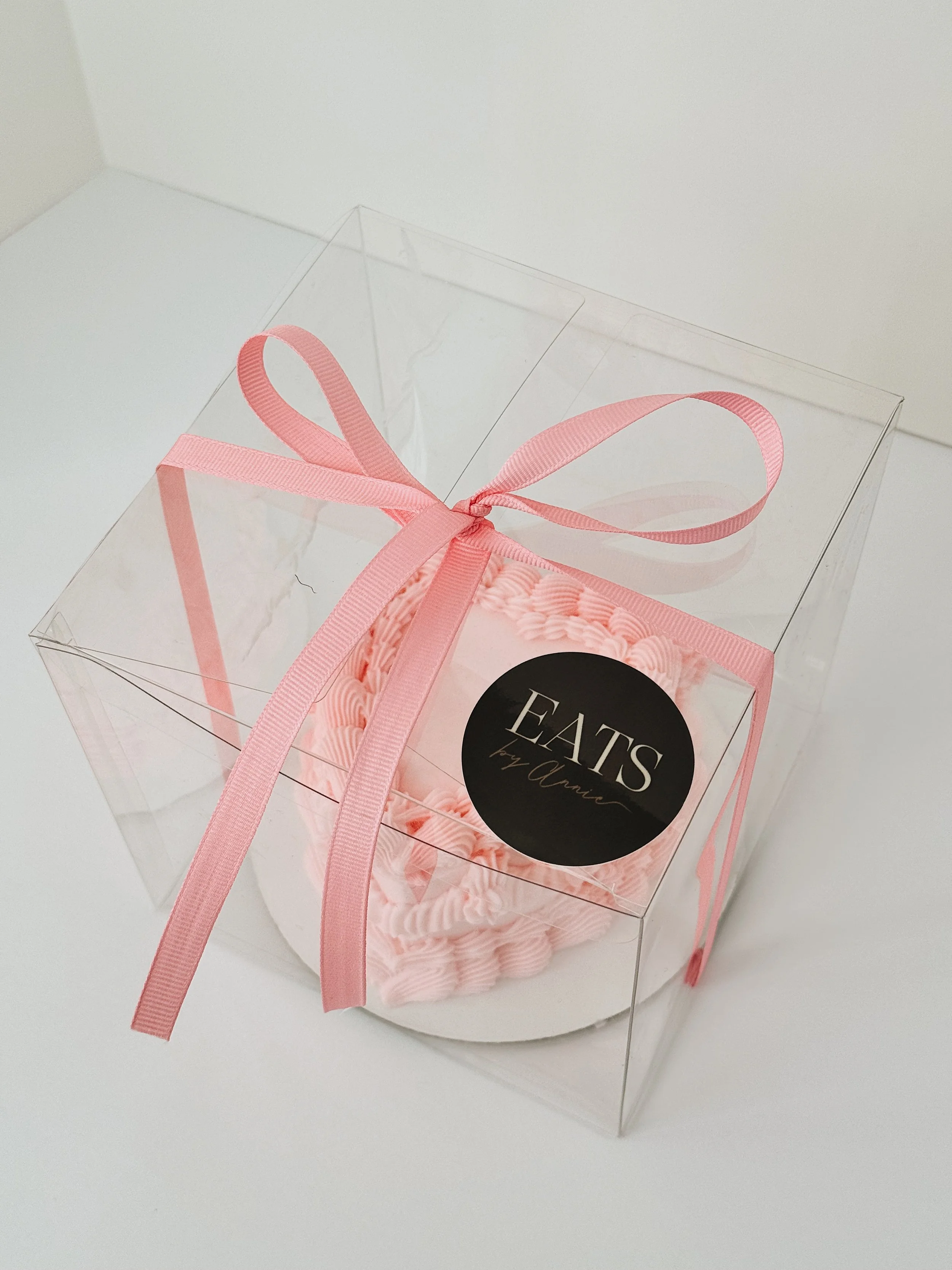 Pink vintage heart cake in a gift box with pink bow for valentine's day