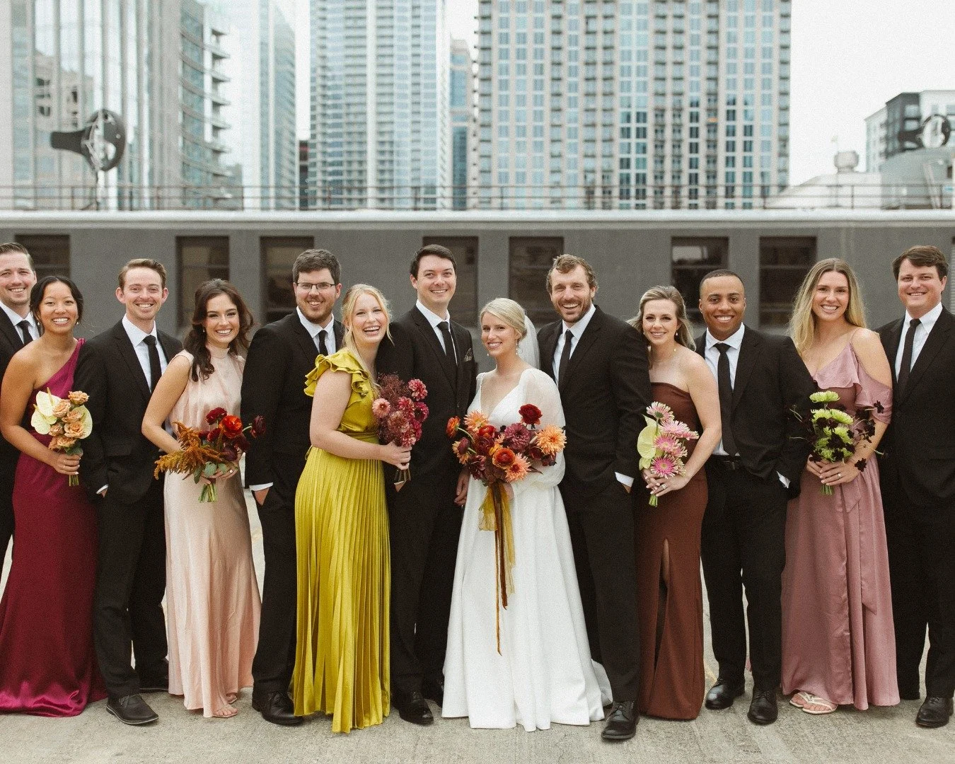 From The Terrace to the heart of the city &mdash; the dreamiest bridal party moment with Charlotte as the backdrop. 

Planning + Design:  @honeythymeevents 
Venue:  @terrace_atcedarhill 
Florals:  @seededeventsanddesign 
Custom Fabrications: @unspoke