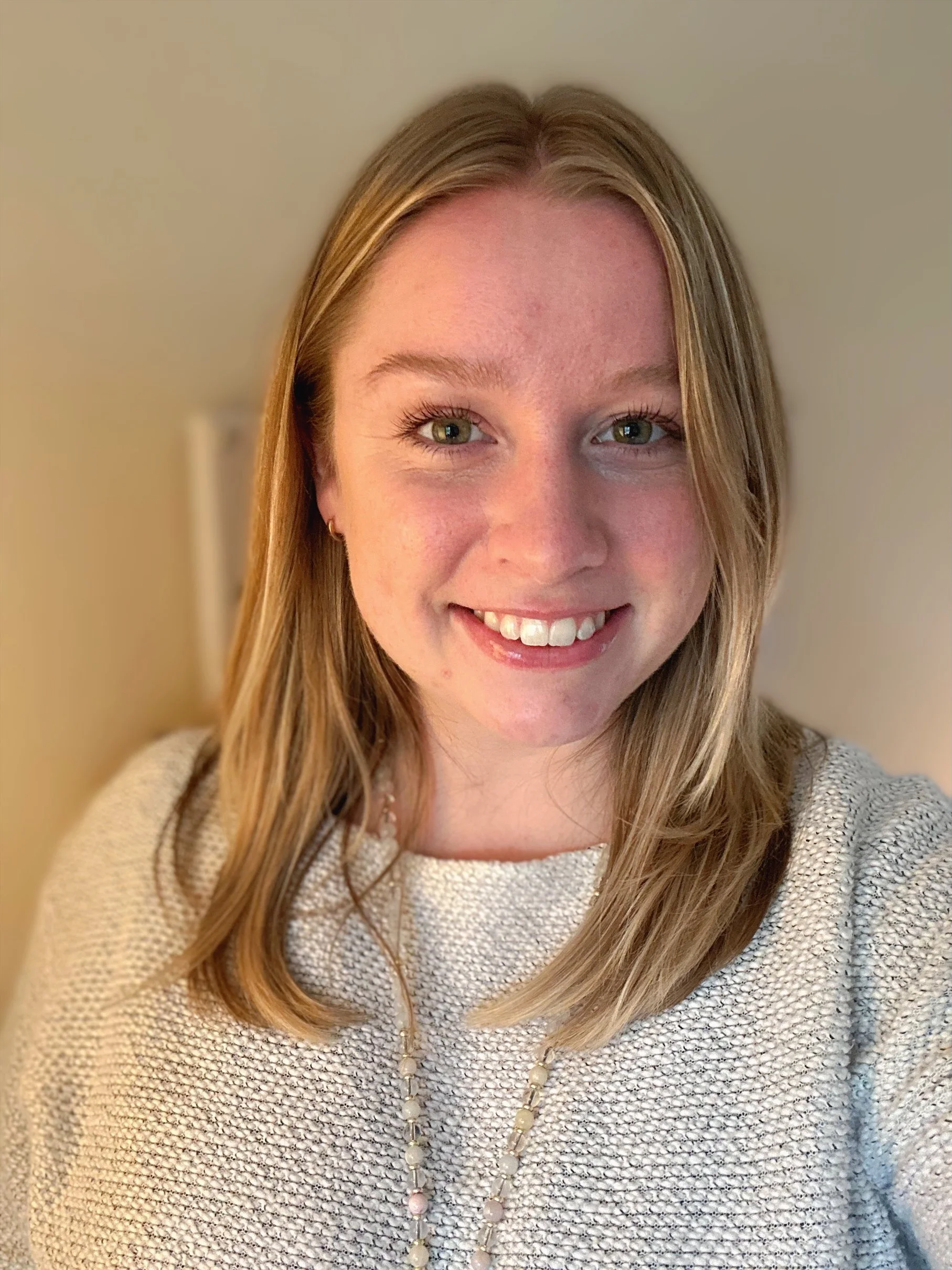 Close-up photo of a purple, transparent, icy surface with reflective and crystalline textures.