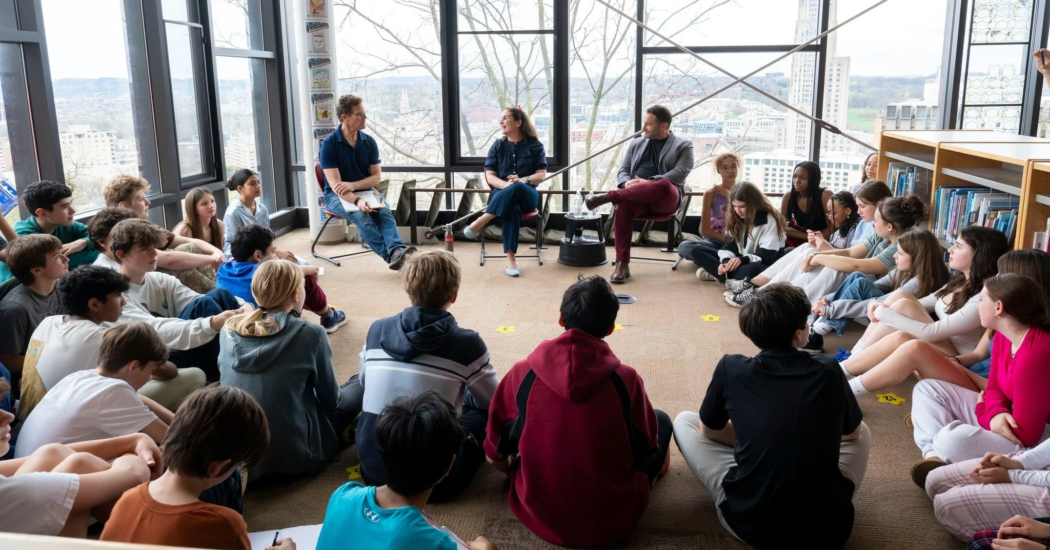 Katie Dealy speaking with middle school students in Falk Library. Photo credit: The Falk School ©