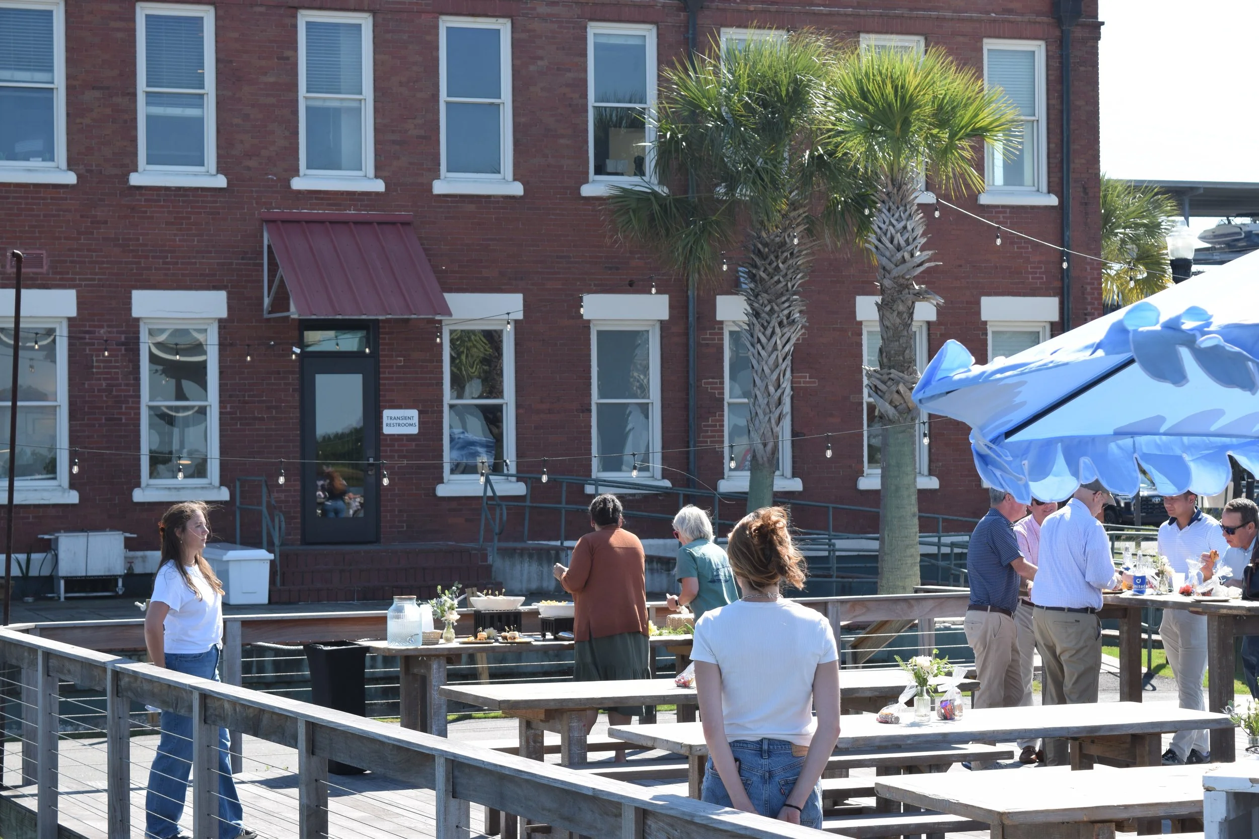 Water view of guest arriving for their happy hour