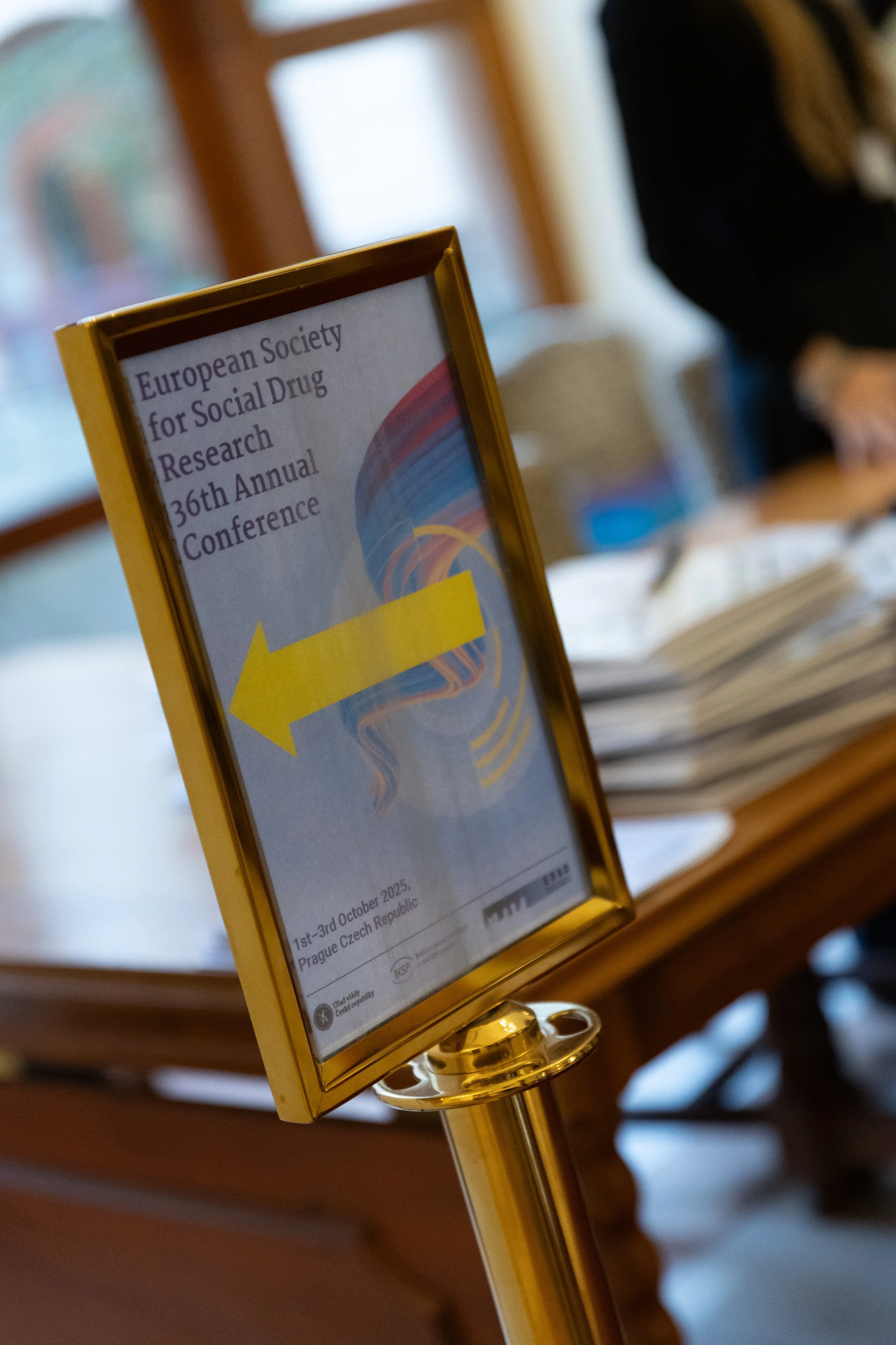 Sign indicating directions for the European Society for Social Drug Research 36th Annual Conference, scheduled for October 1st-3rd, 2025 in Prague, Czech Republic.