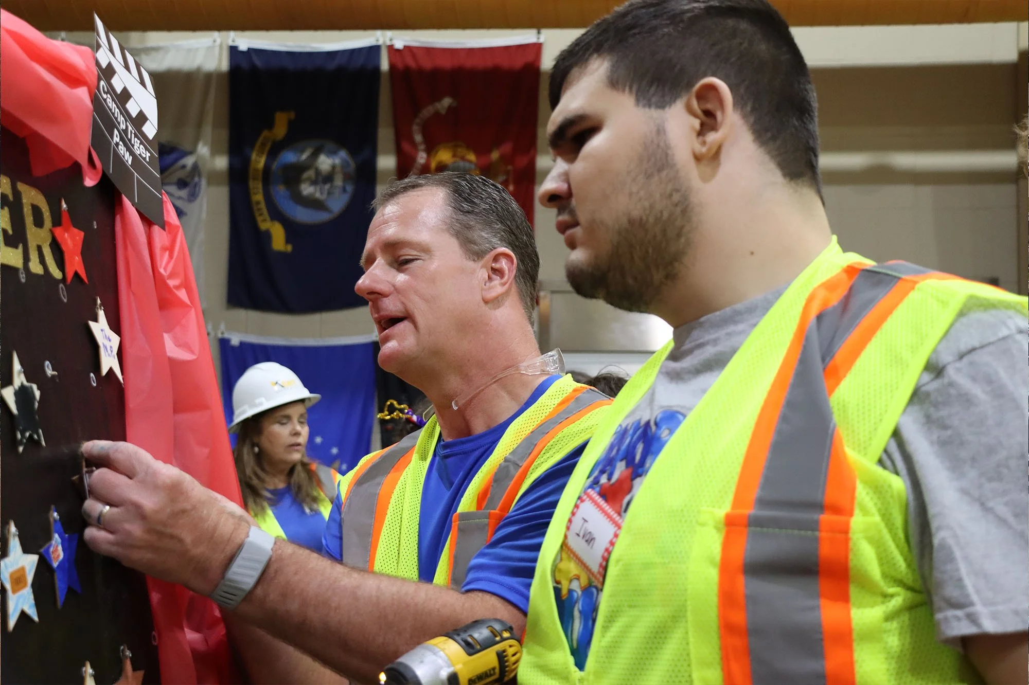 Kyle Kent helps a Camp Tiger Paw participant with a construction activity at St. Timothy’s United Methodist Church.