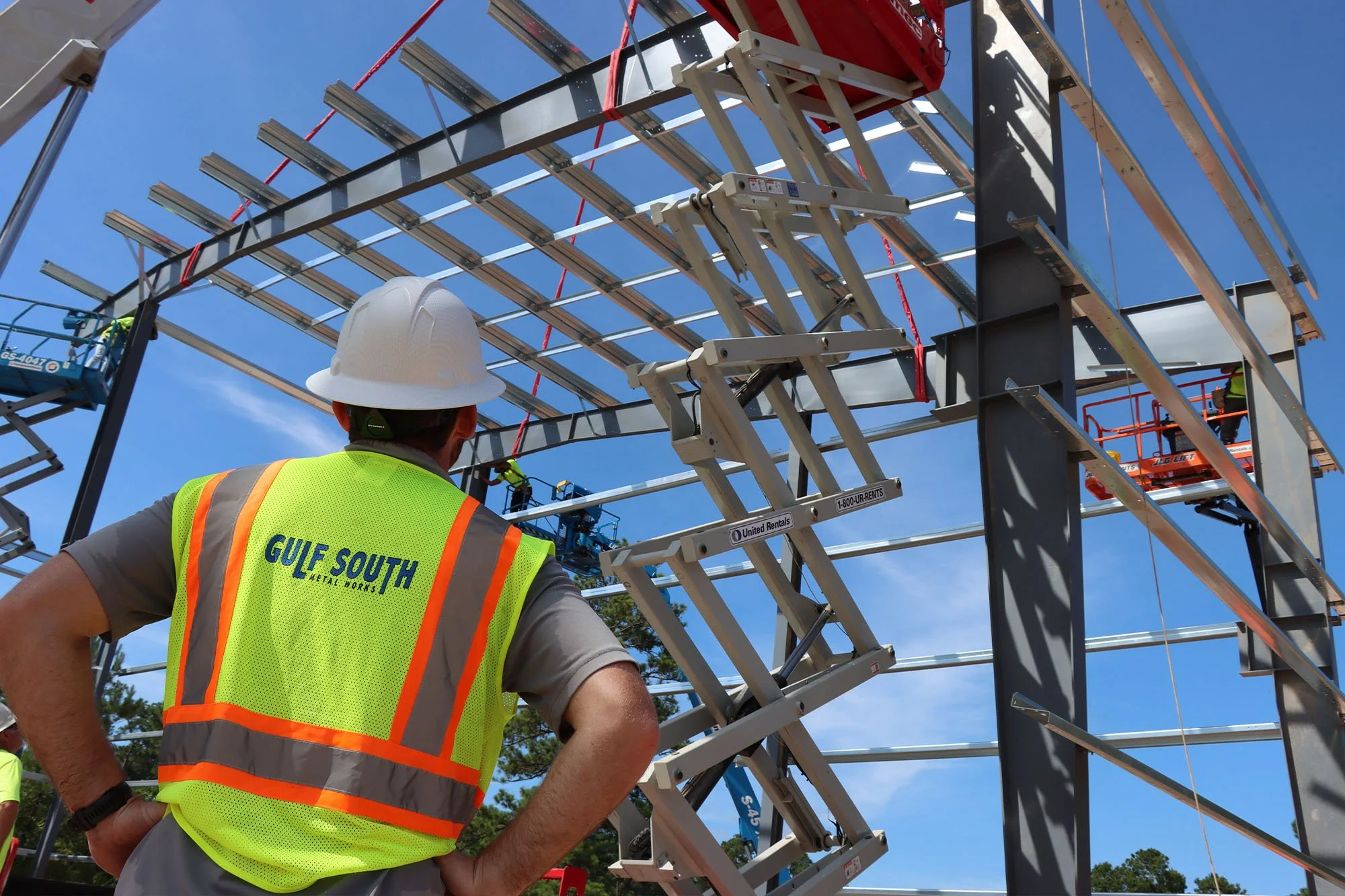 Jake Palmisano supervises as a steel module is lifted into place at the Laborde Products construction site.